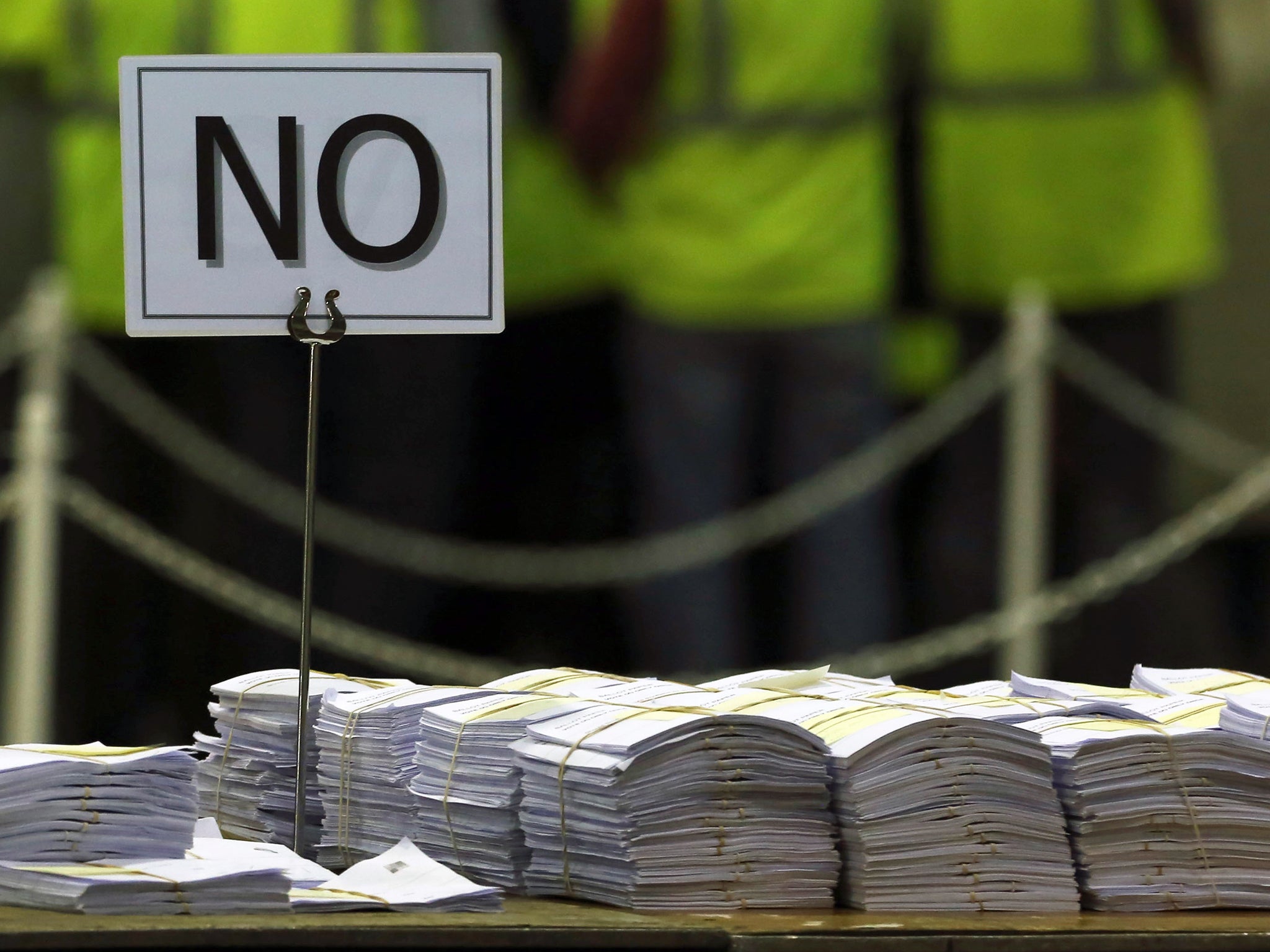 NO ballots are stacked on a table during the Scottish independence referendum count at the Royal Highland Centre in Edinburgh