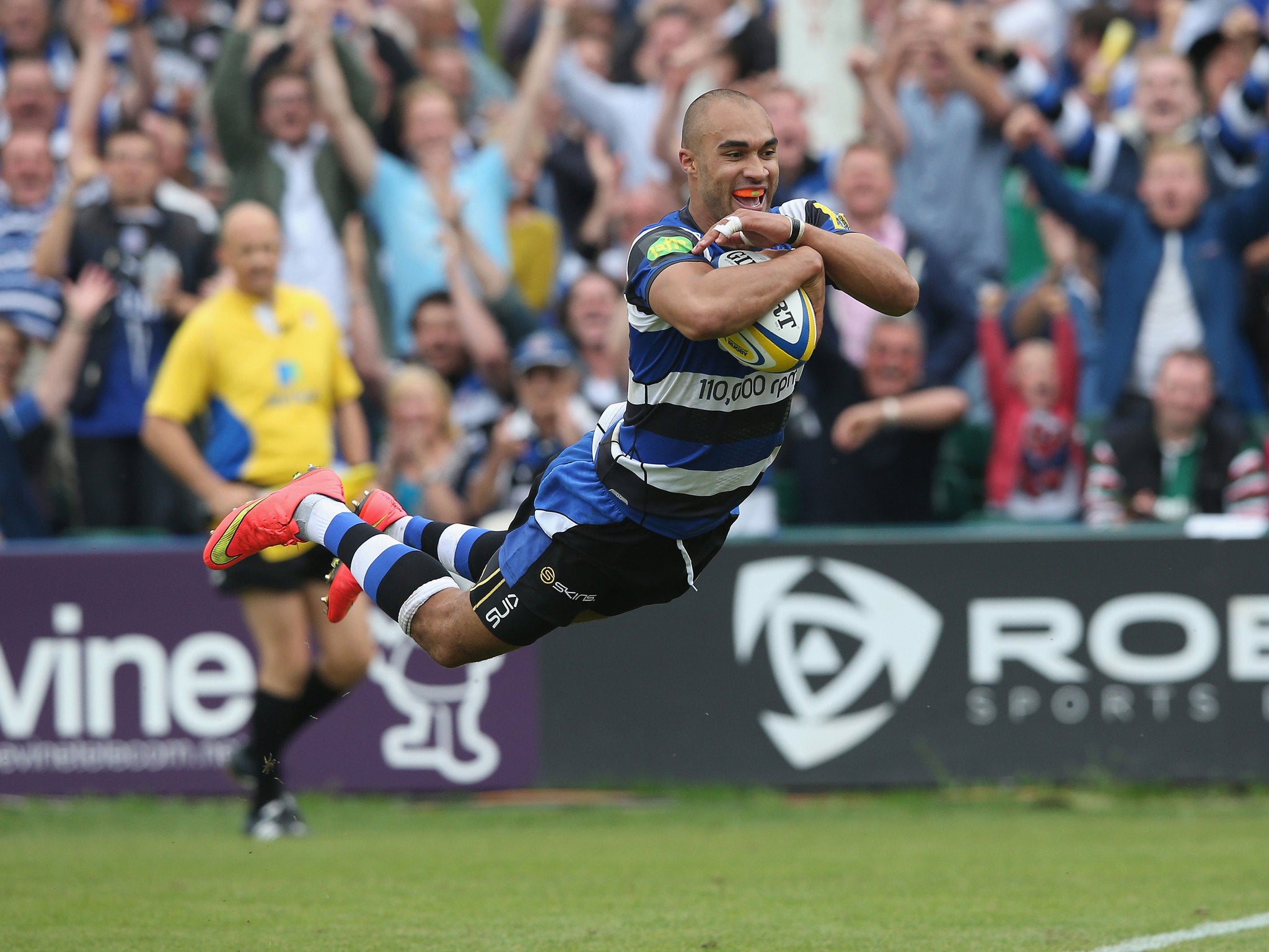 Olly Woodburn dives over for a try