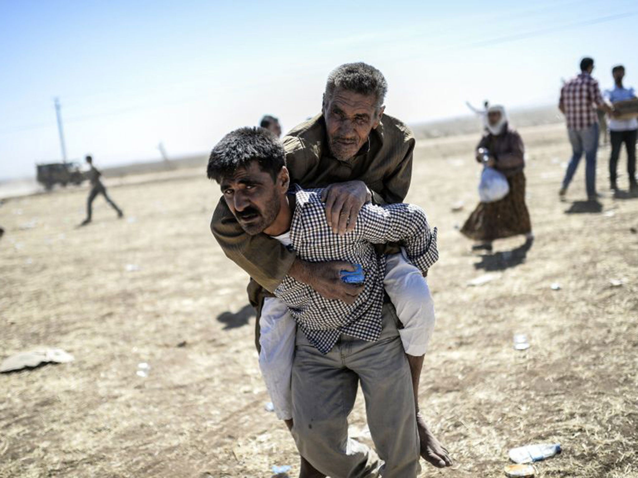 60,000 Syrian Kurds are reported to have fled to the border with Turkey