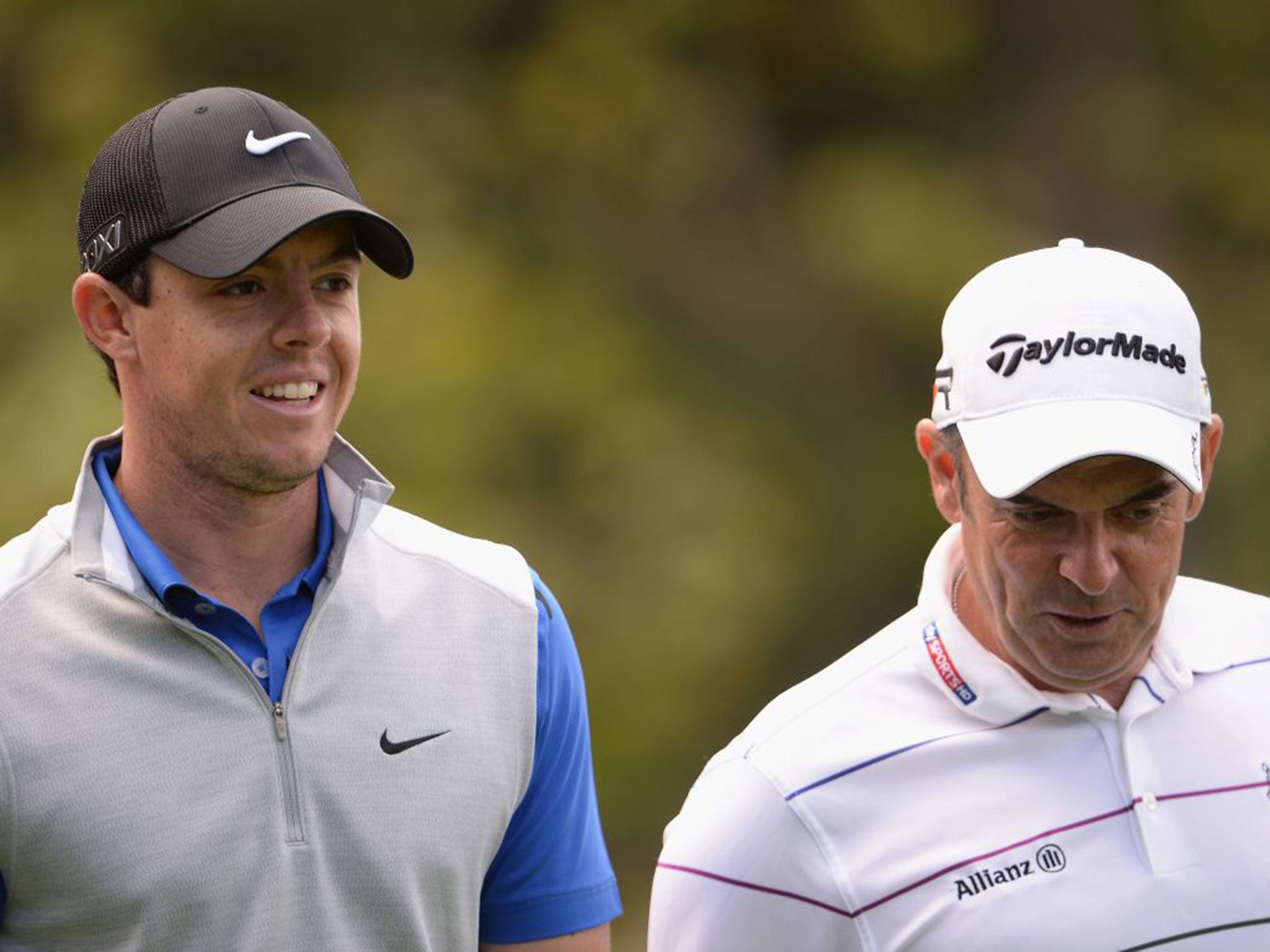 In the swing of it: Rory McIlroy, left, and Europe captain Paul McGinley