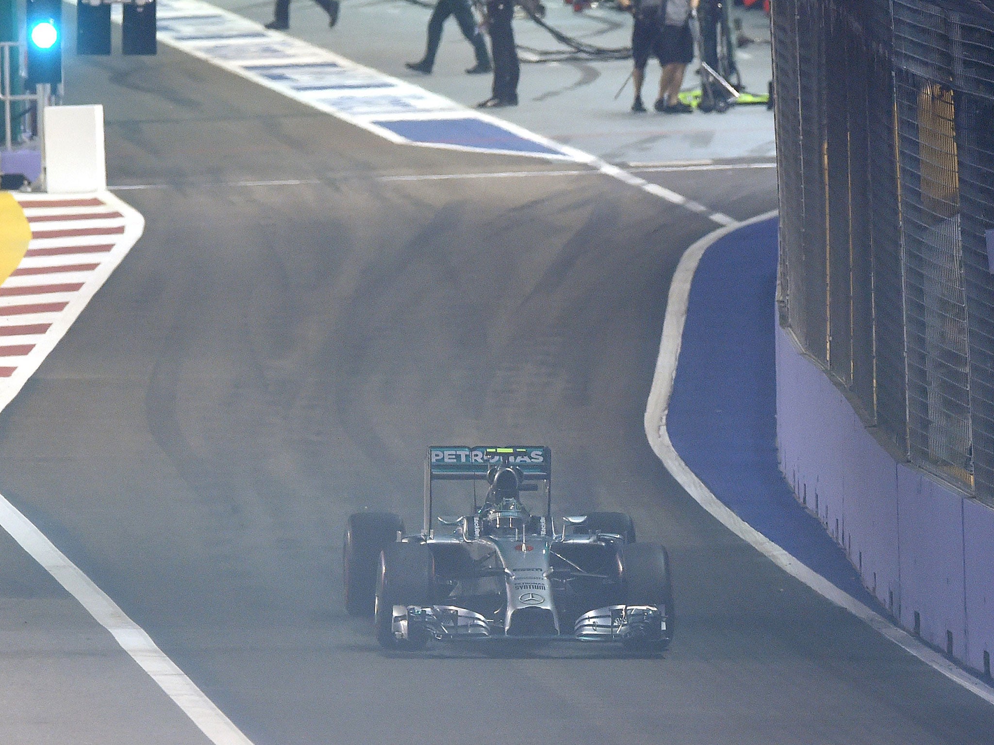 Mercedes driver Nico Rosberg of Germany starts from the pit during the Singapore Grand Prix