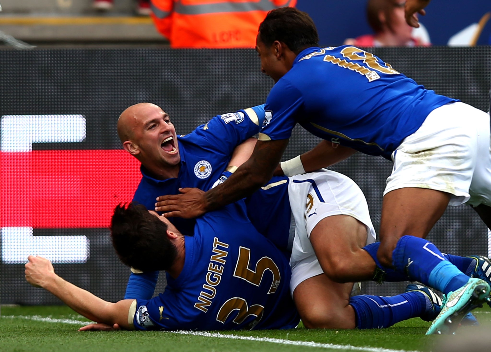 Esteban Cambiasso celebrates after scoring Leicester's equaliser