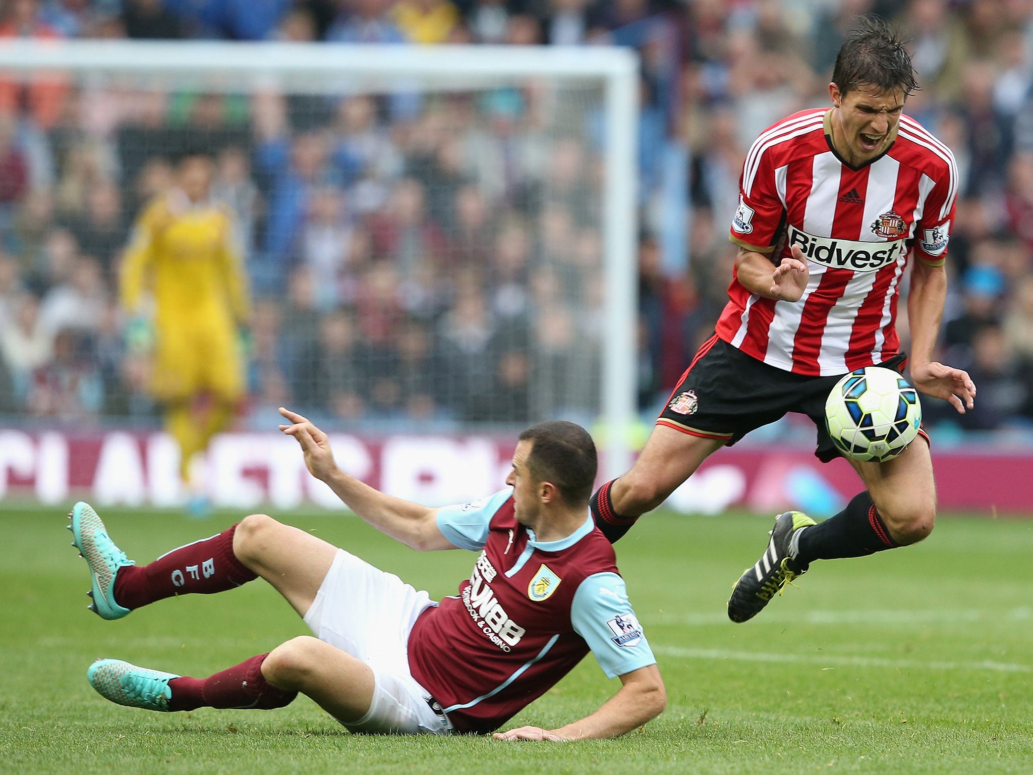 Dean Marney of Burnley tackles Santiago Vergini of Sunderland