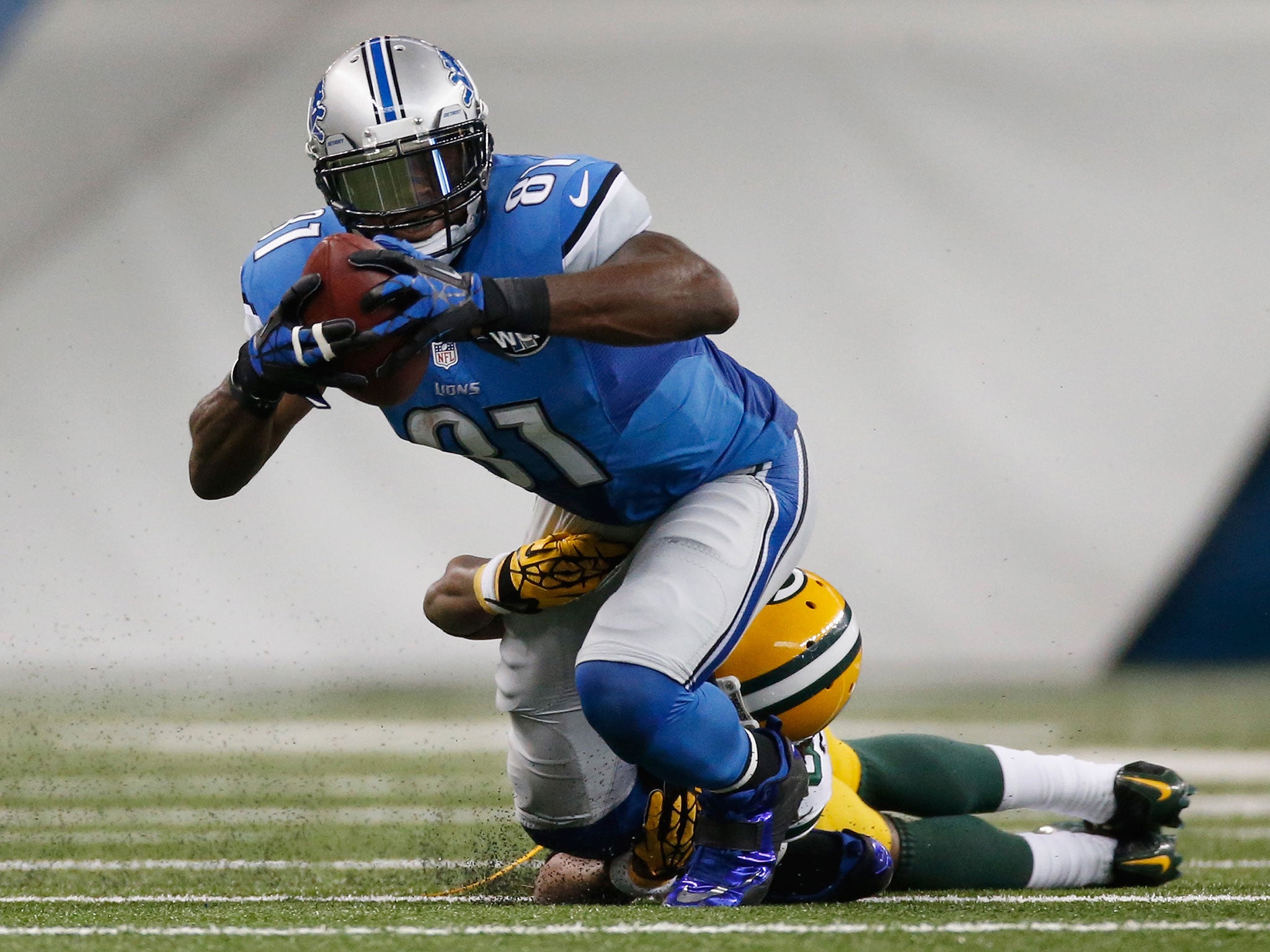 Calvin Johnson attempts to break free during the Lions' victory over the Packers