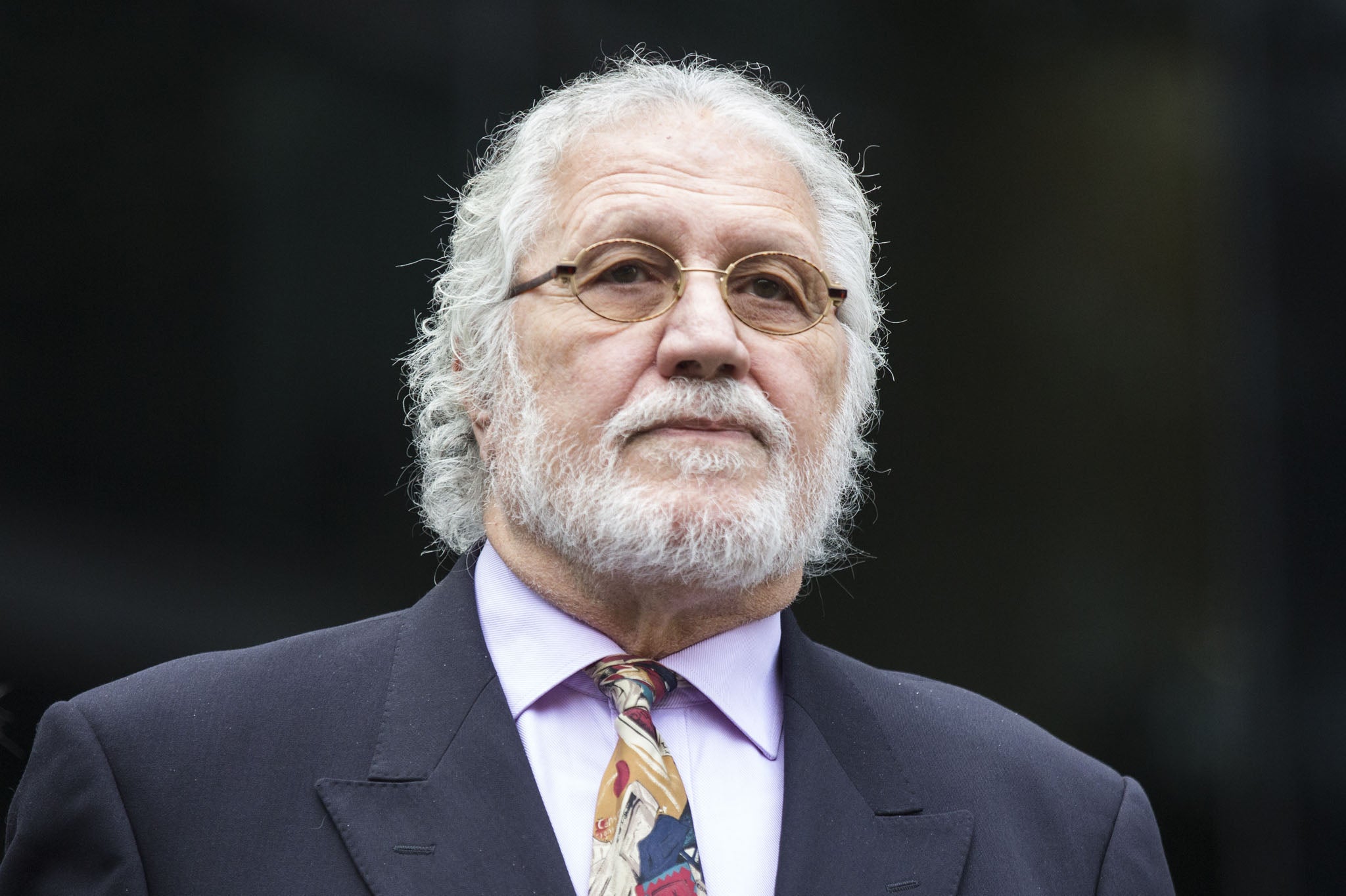 Dave Lee Travis arrives in court on 22 September 2014