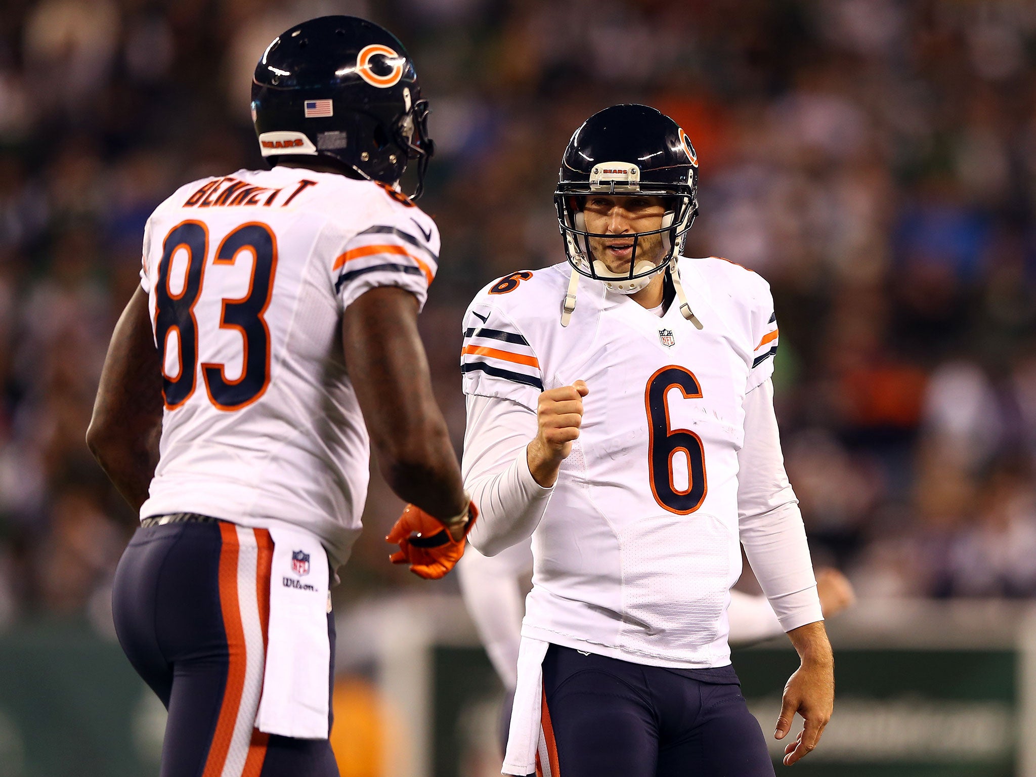 Jay Cutler celebrates with Martellus Bennett after hitting the tight end for a touchdown