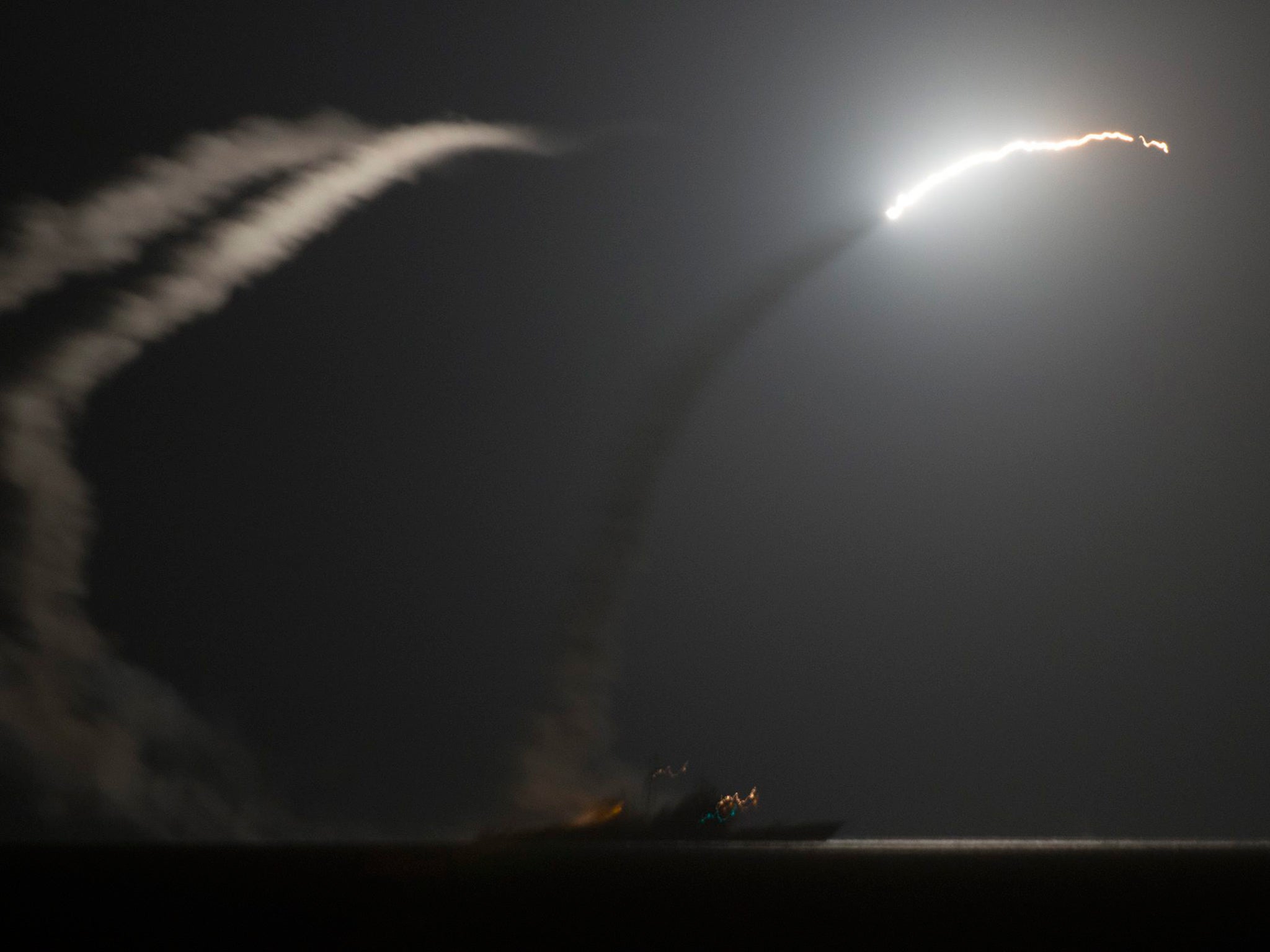 The guided-missile cruiser USS Philippine Sea (CG 58) launching a Tomahawk cruise missile against Isis targets in Syria, as seen from the aircraft carrier USS George H.W. Bush (CVN 77) in the Arabian Gulf