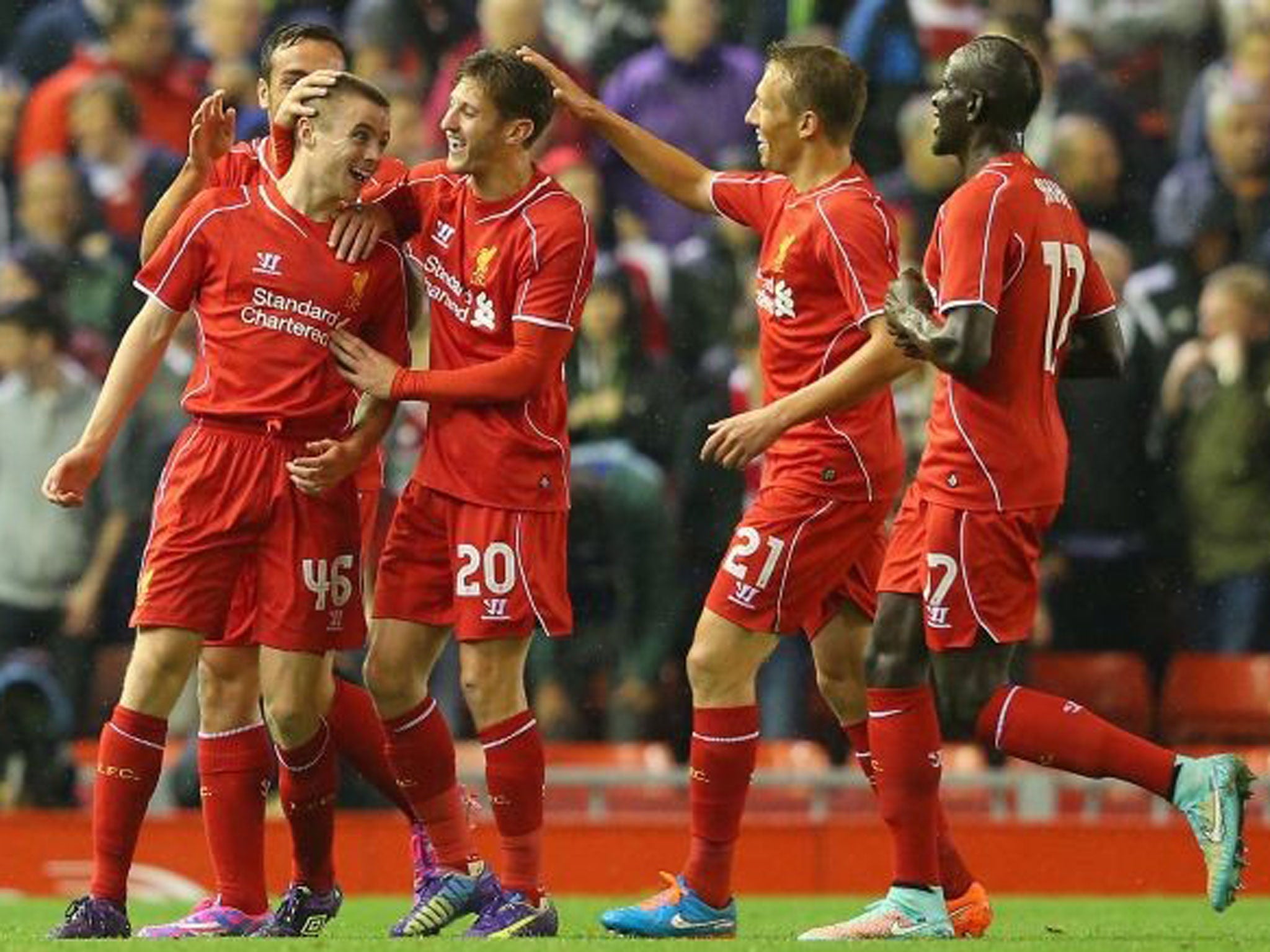 Jordan Rossiter celebrates with team mates after scoring the opening goal during the match between Liverpool and Middlesbrough at Anfield