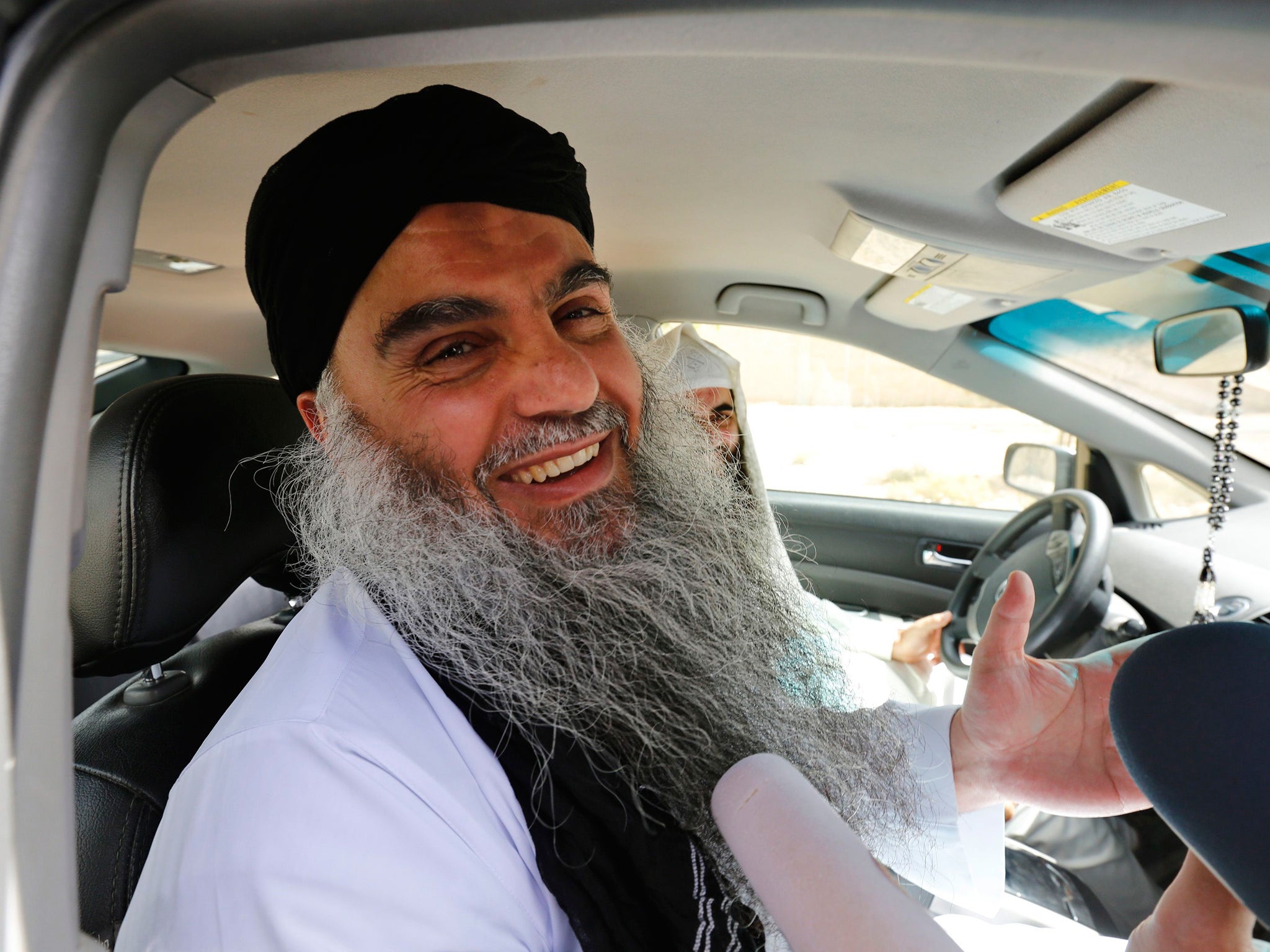 Radical Muslim cleric Abu Qatada speaks to the media after his release from Mwaqar 2 prison near Amman