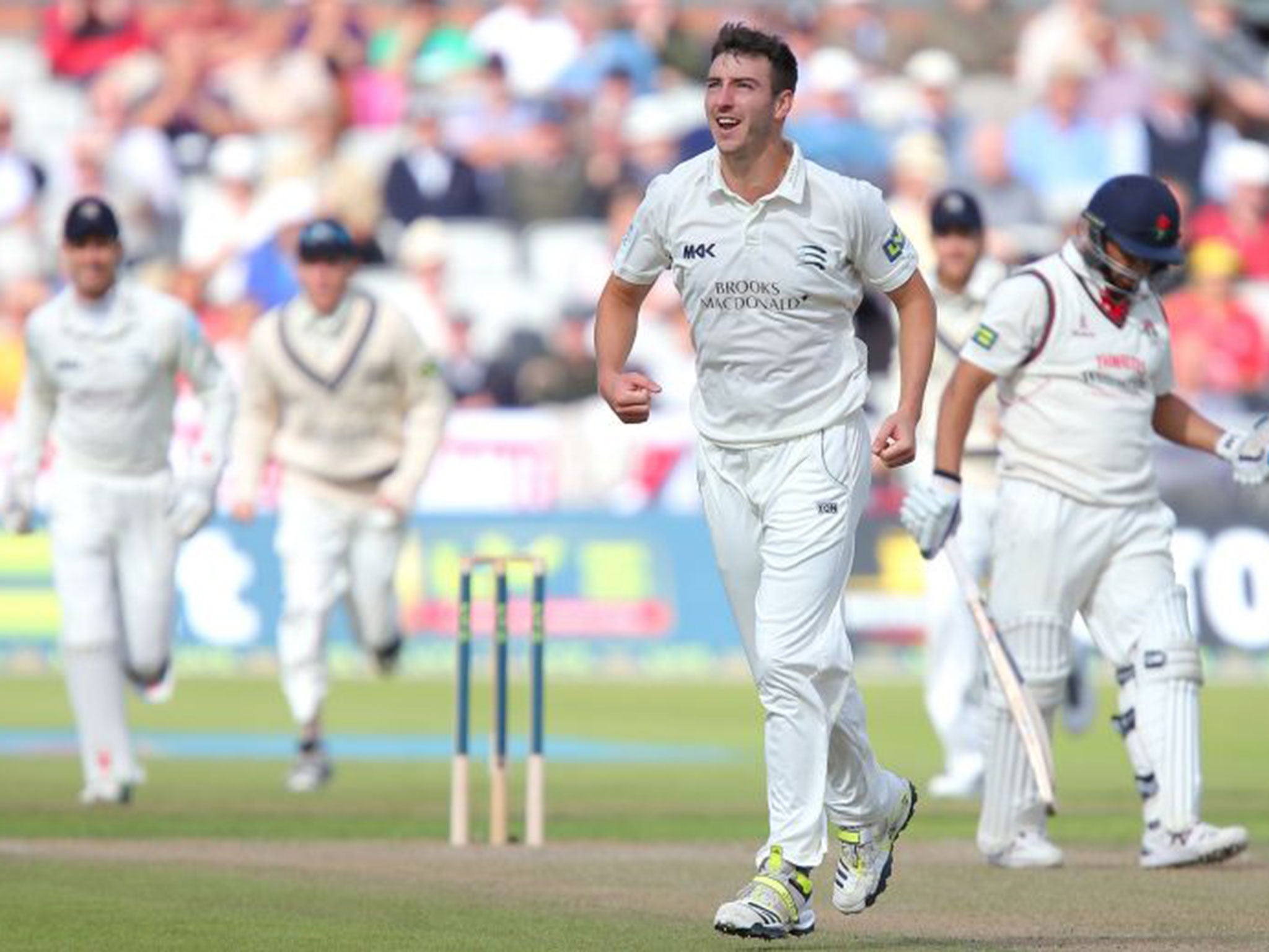 Toby Roland-Jones of Middlesex celebrates dismissing Ashwell Prince at Old Trafford