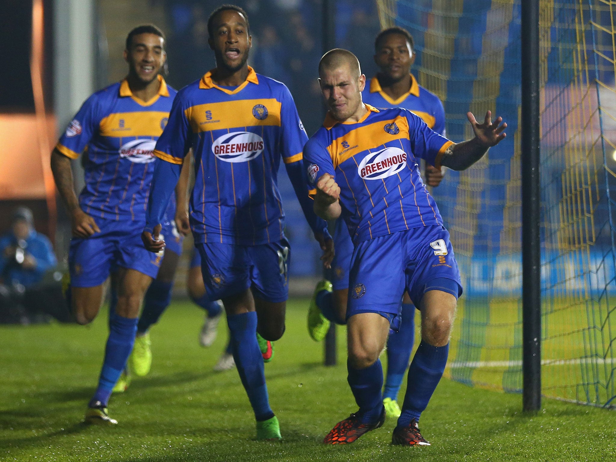 James Collins celebrates scoring for Shrewsbury