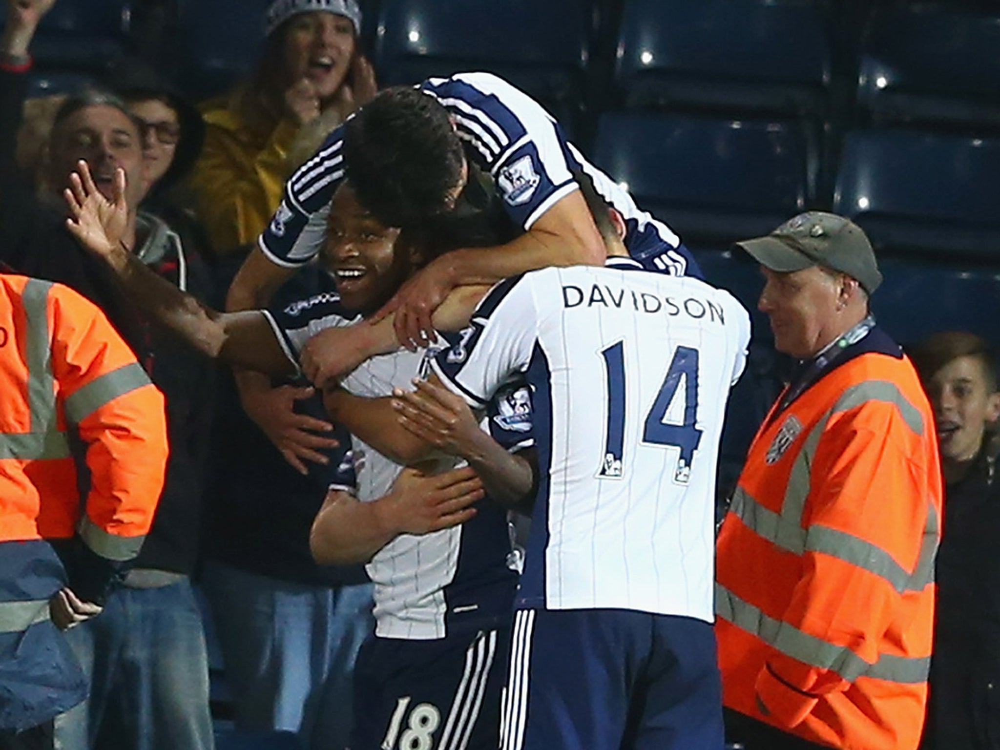 Saido Berahino is mobbed by his West Brom team-mates after scoring a winner against Hull City in the Capital One Cup