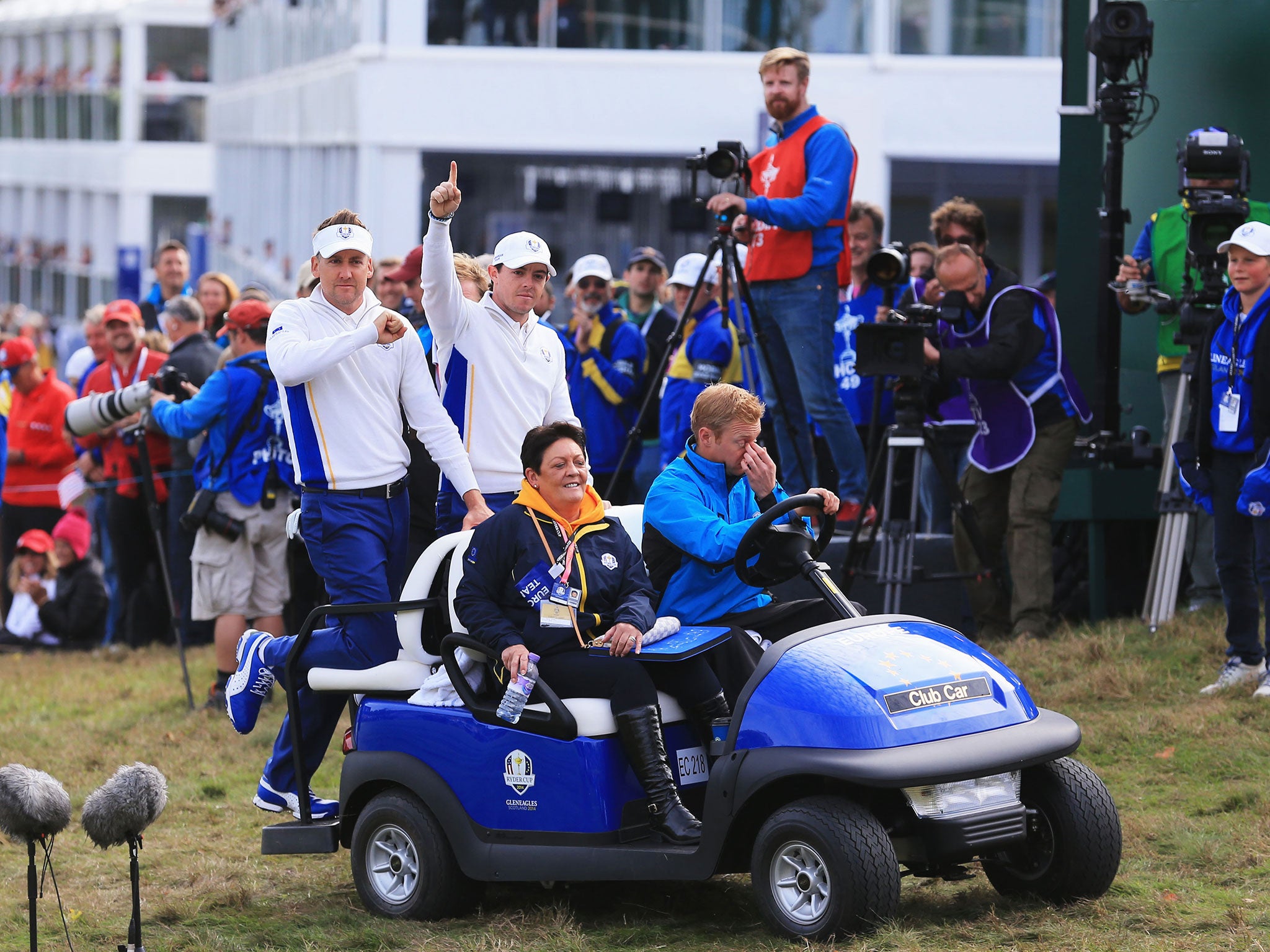 Cruising in style, Poulter and McIlroy make their way back to the clubhouse