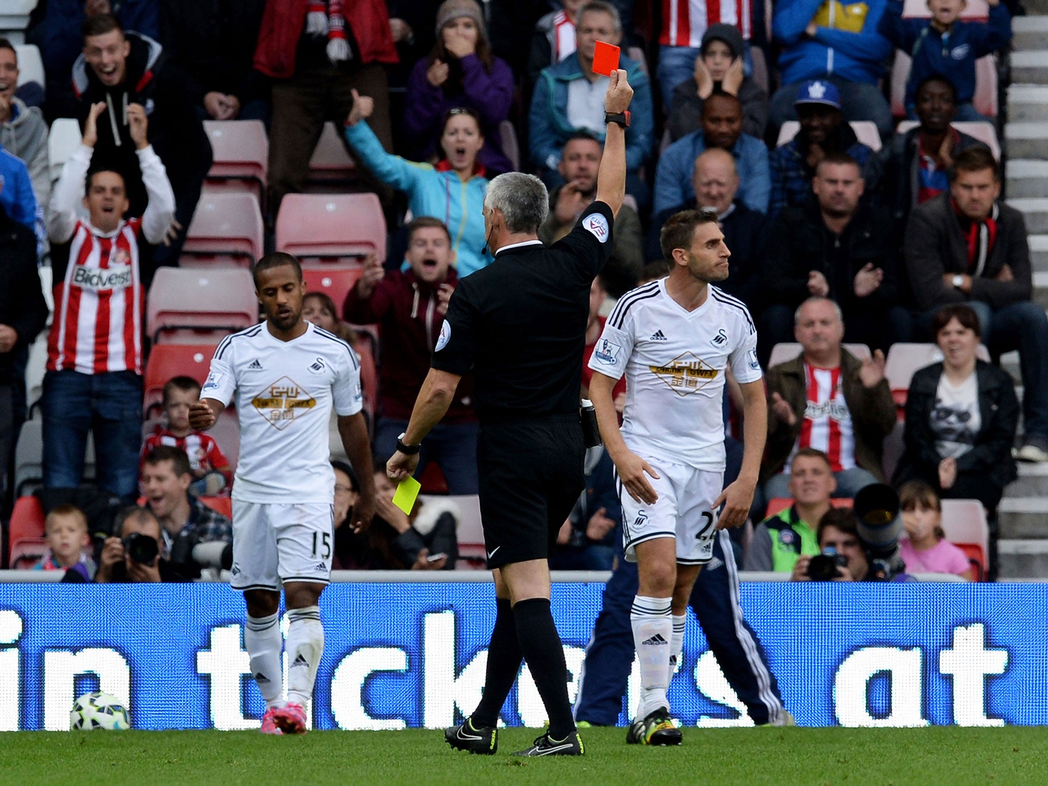 Angel Rangel is sent-off after picking up a second yellow card