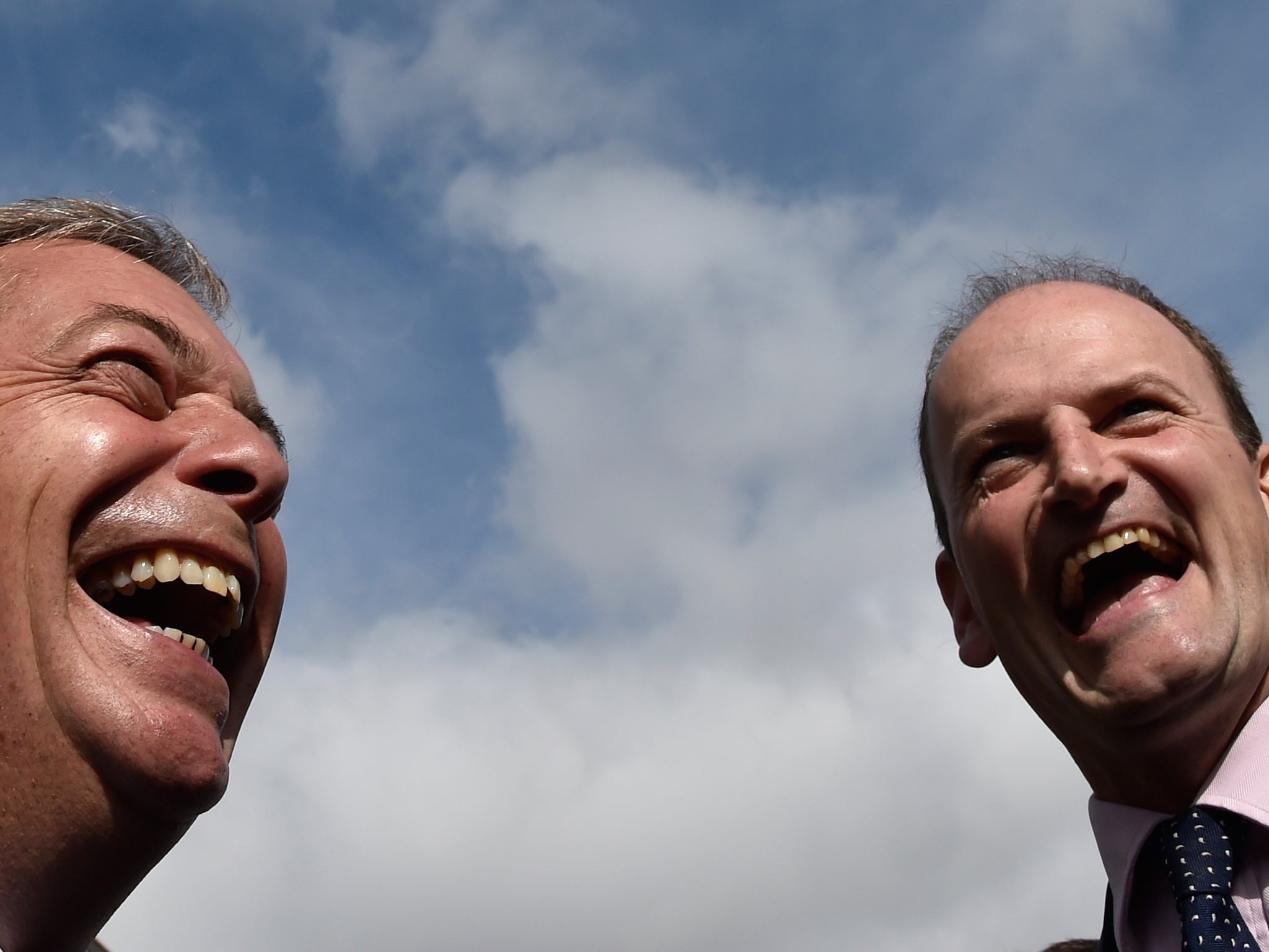 Douglas Carswell and Nigel Farage walk through the town centre of Clacton-on-Sea in south east England on 29 August 2014