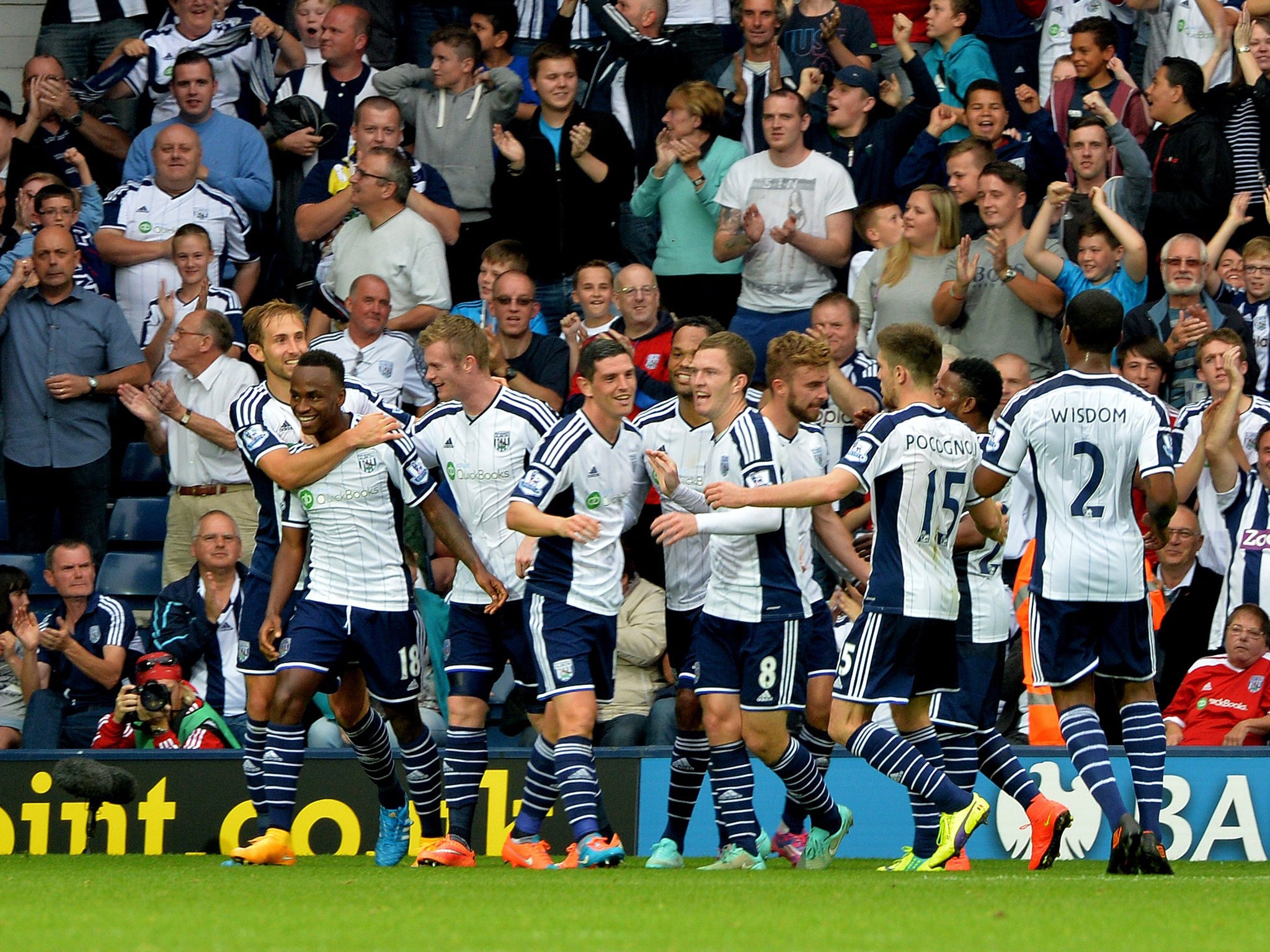 West Bromwich Albion's Burundian striker Saido Berahino (L) is congratulated after scoring their second goal