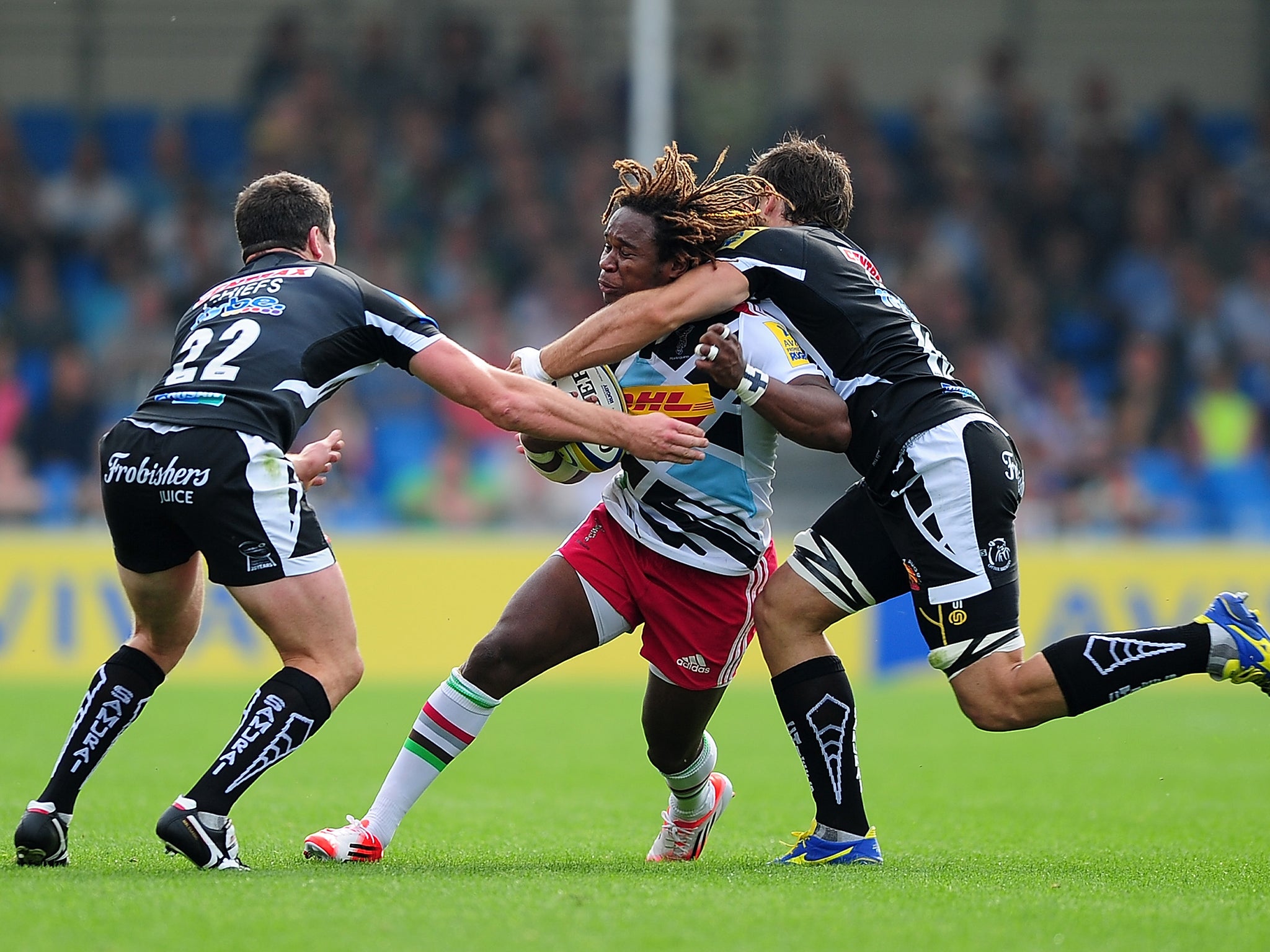 Marland Yarde of Harlequins is tackle by Don Armand and Ian Whitten of Exeter Chiefs