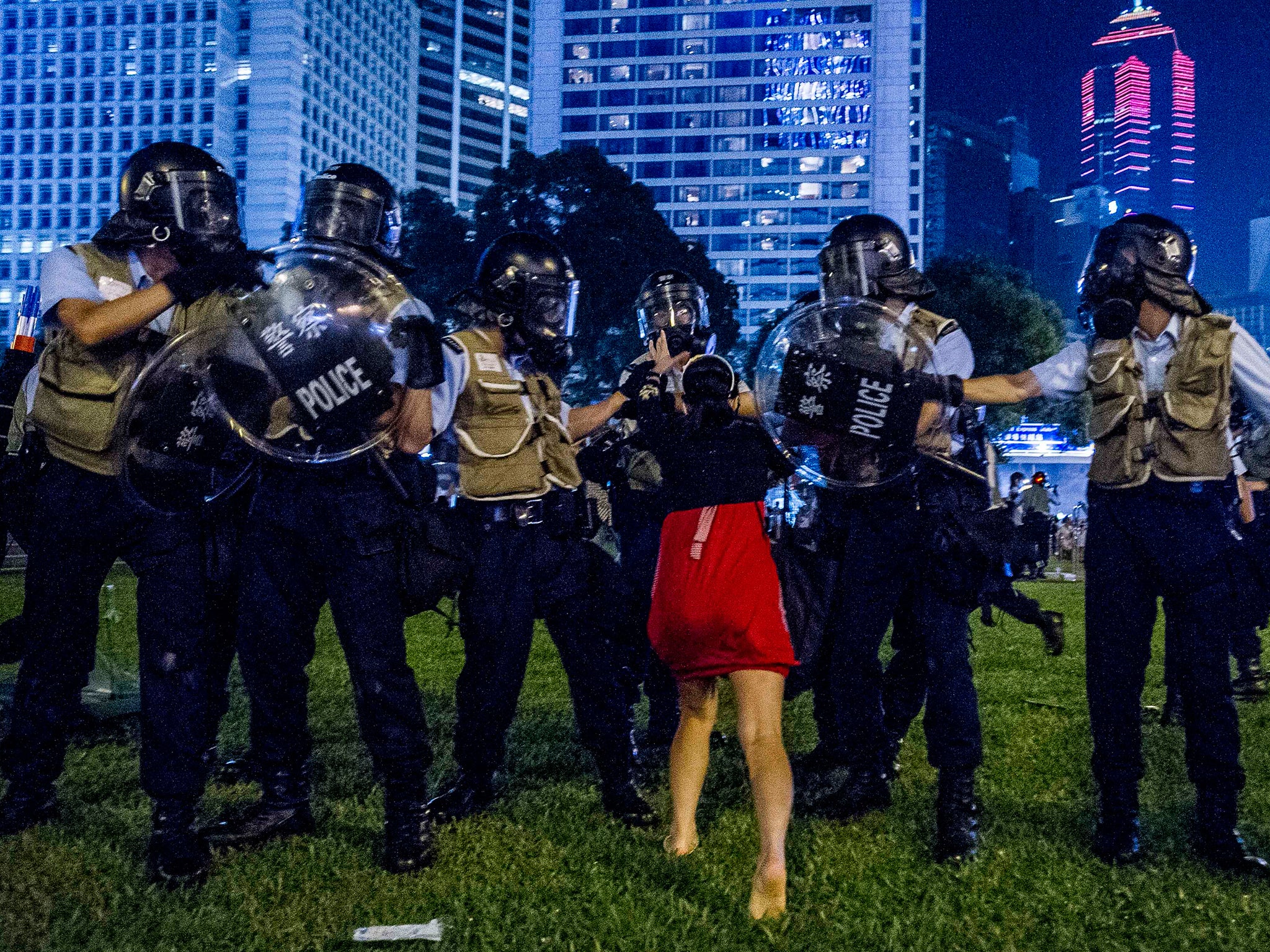 A pro-democracy protester confronts the police during a demonstration in Hong Kong