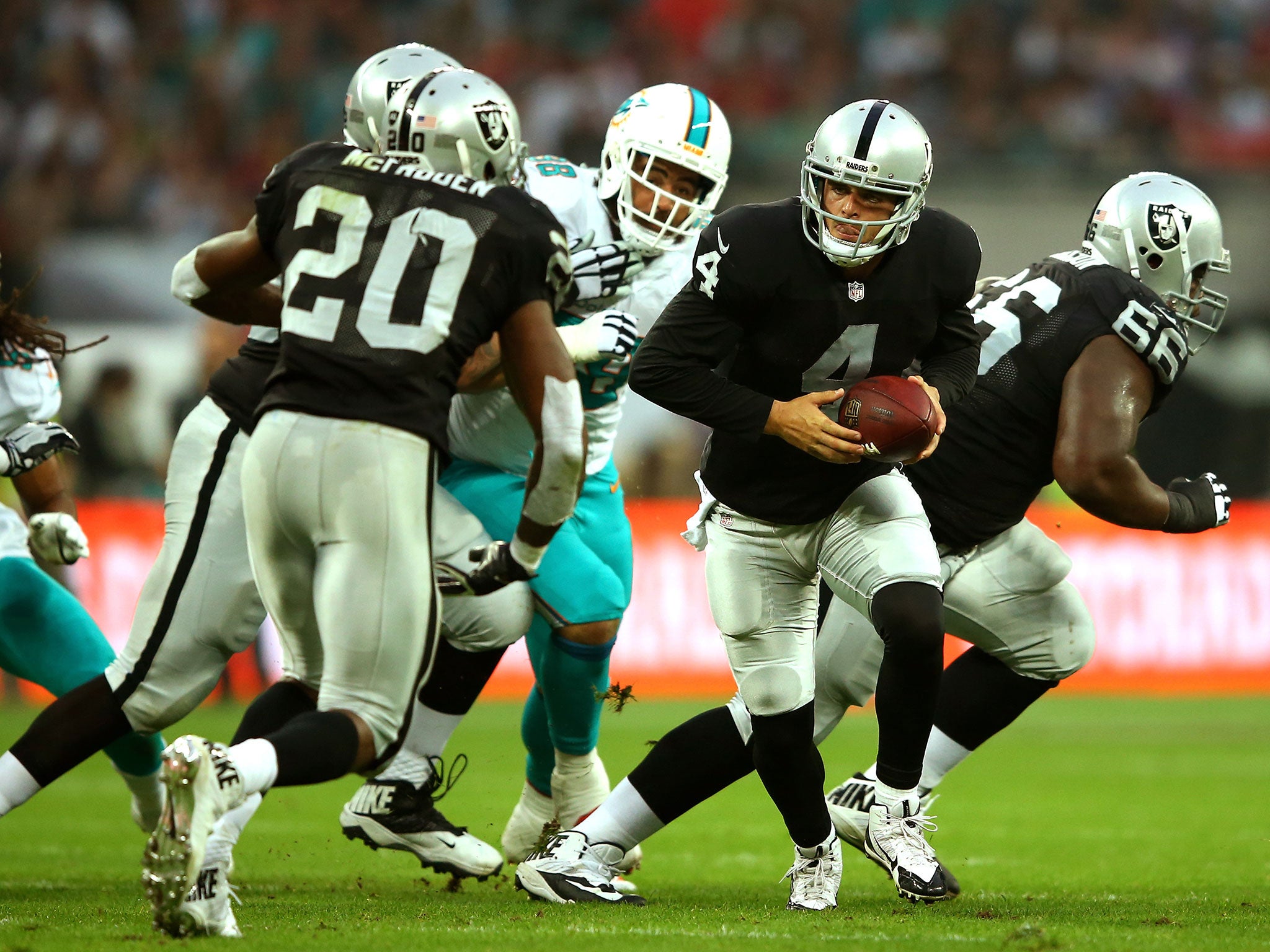 Raiders quarter-back Derek Carr limped off the Wembley pitch with a knee and ankle injury