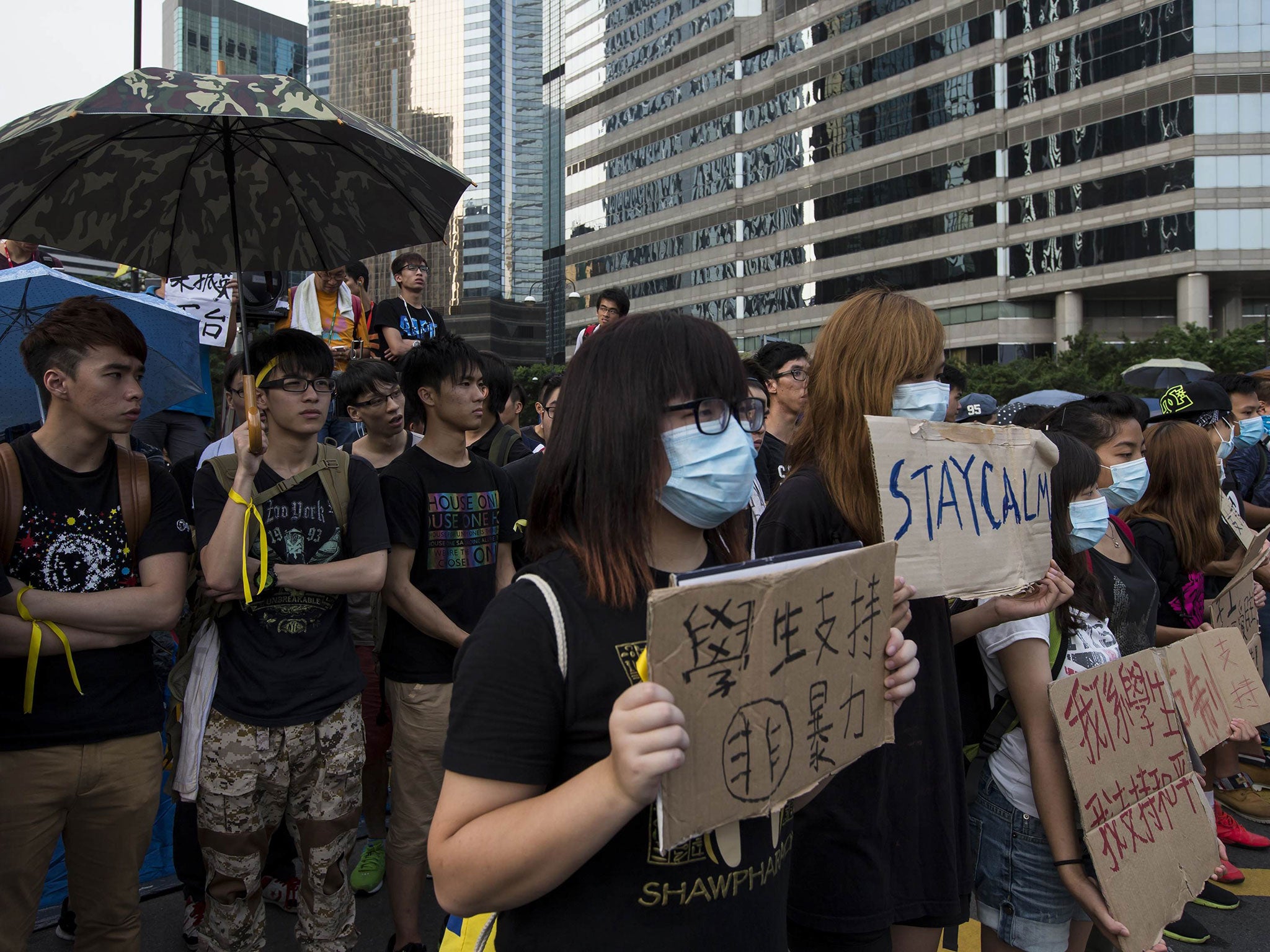 Student protesters gather outside the venue of the official flag-raising ceremony for celebrations of China's National Day