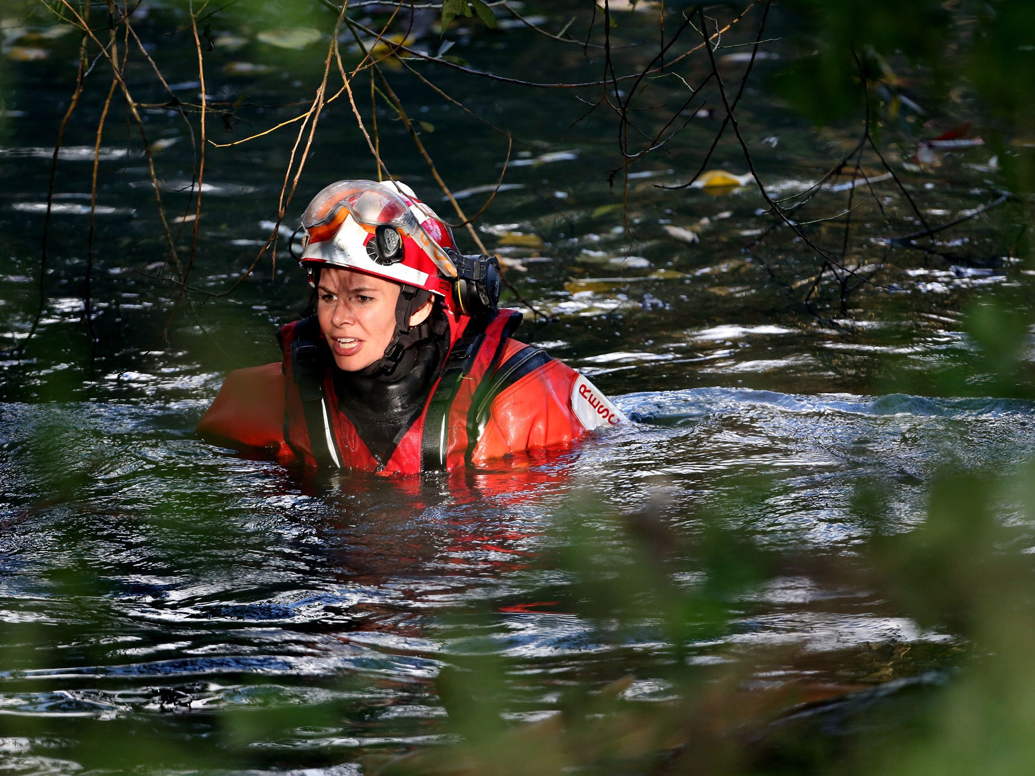 Specialists from the London Fire Brigade Urban Search and Rescue team clear the bank of the river Brent in Hanwell, west London searching for missing Alice Gross