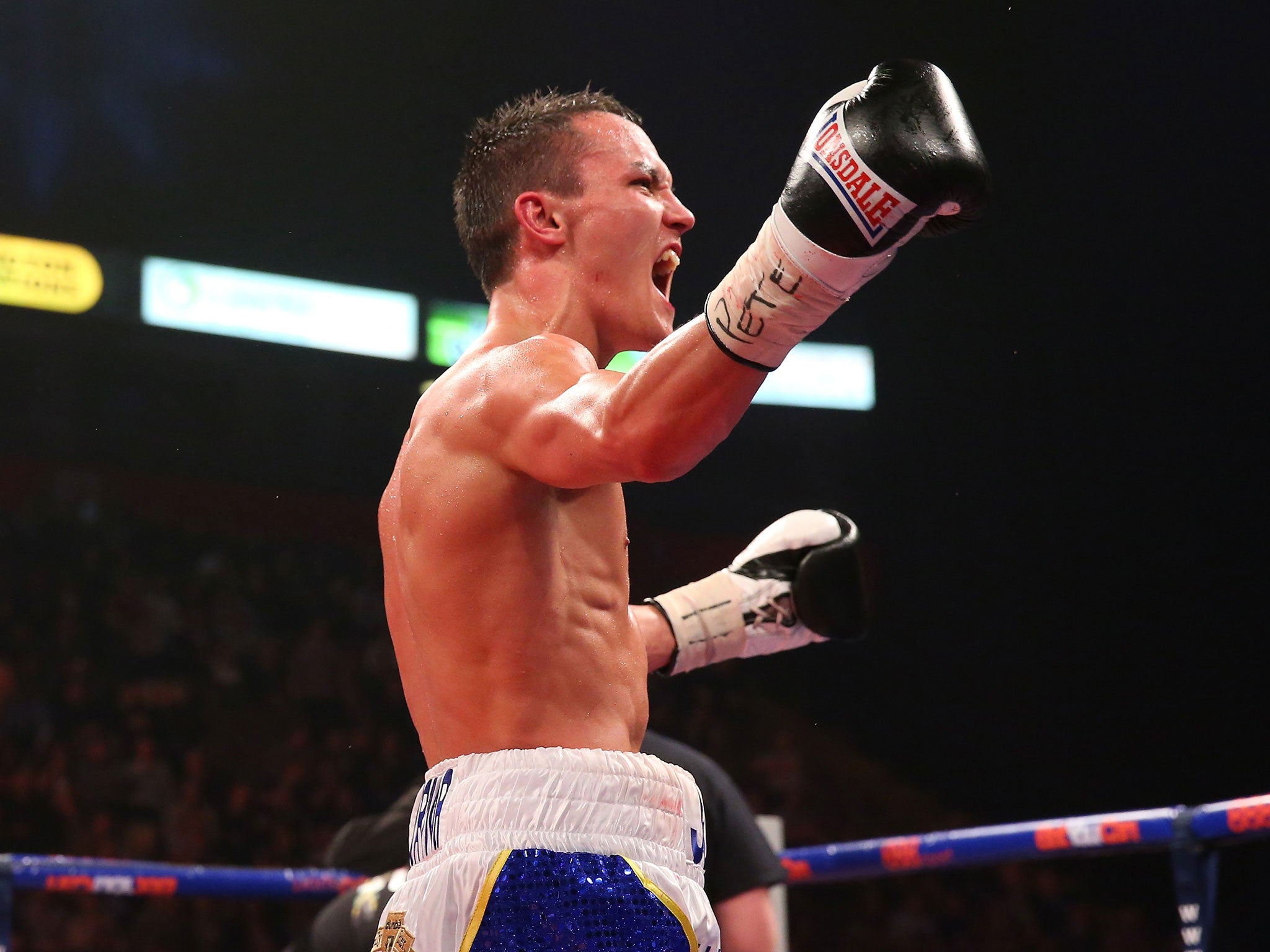 Josh Warrington celebrates after stopping Rendall Munroe in April