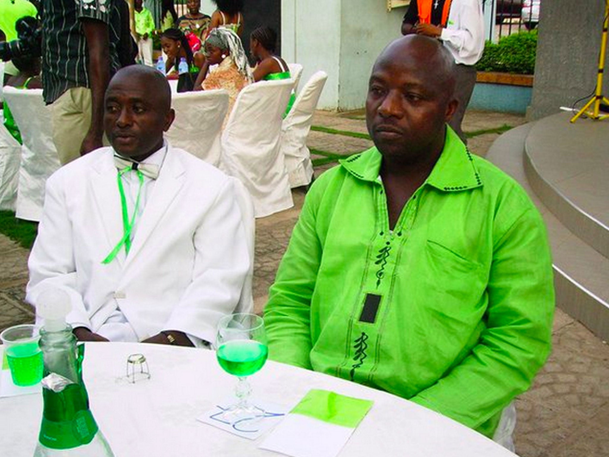 Thomas Eric Duncan, right, with a friend at a wedding in Ghana. Duncan has been kept in isolation at a hospital