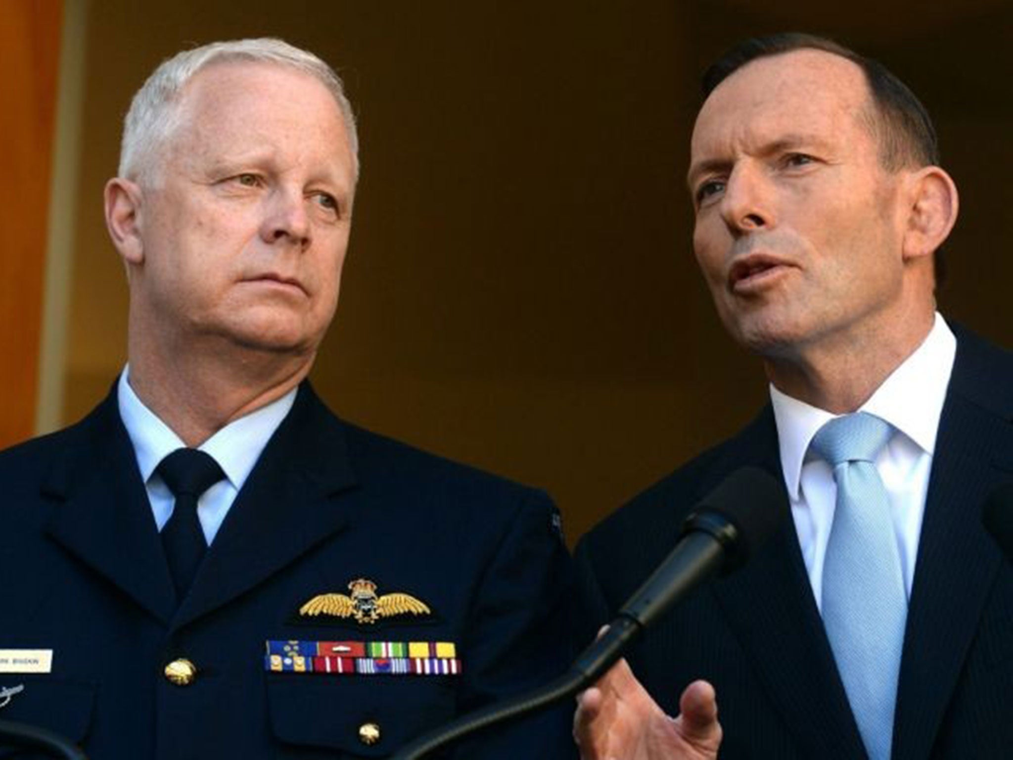 Australian Prime Minister Tony Abbott (R) and Australian Defense Force Chief Air Marshal Mark Binskin announcing the air strikes