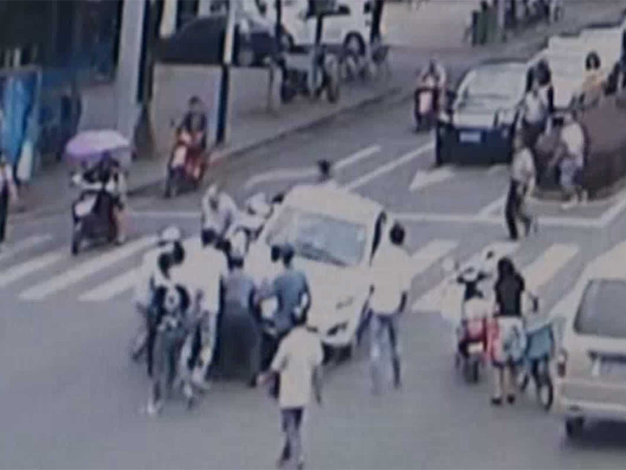 Captured on CCTV, the moment the car is lifted off an elderly man