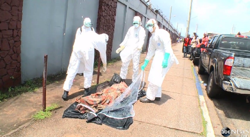 A still from the video shows the team about to cover the man