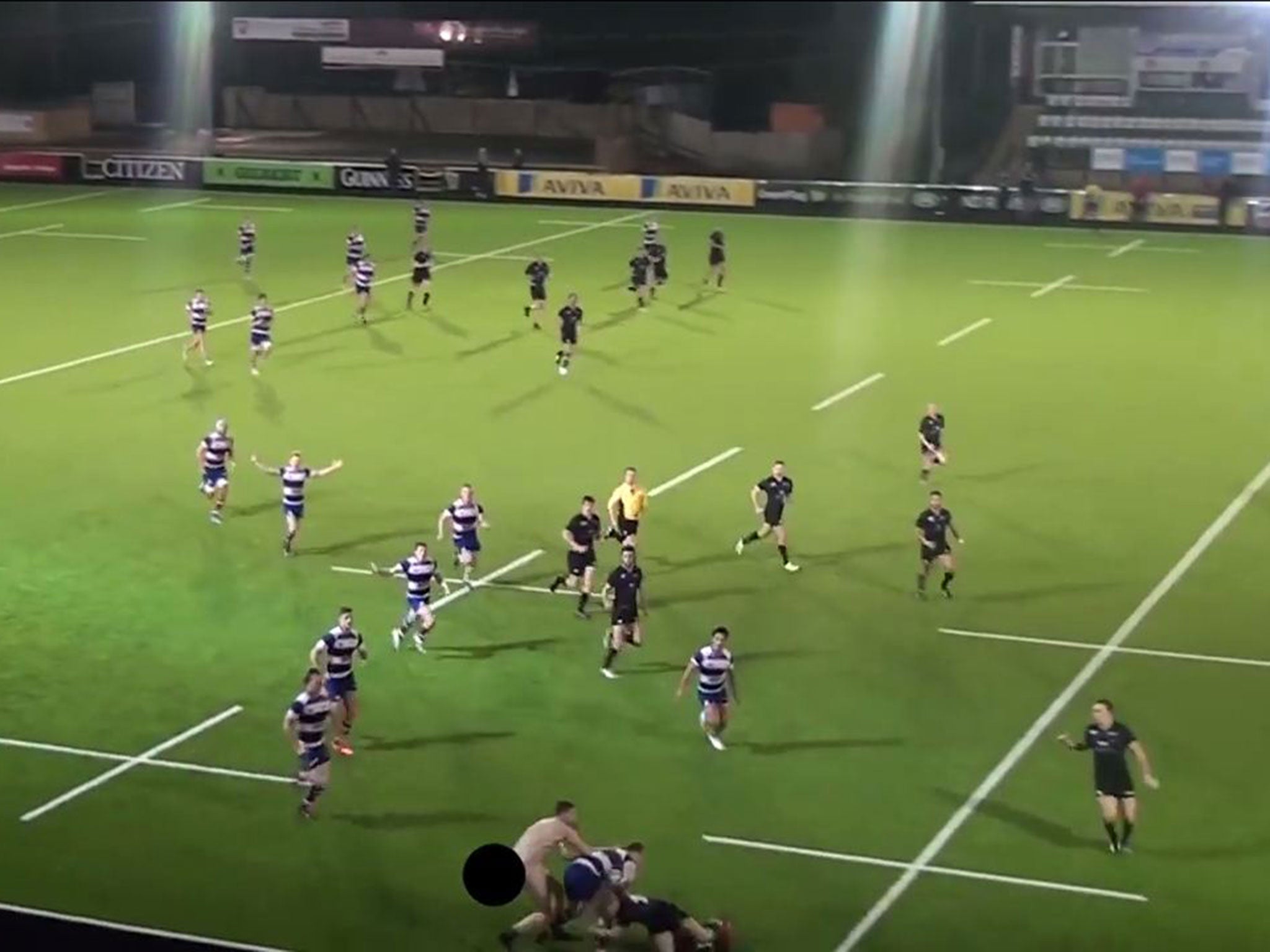 A streaker tackle a Newcastle University player