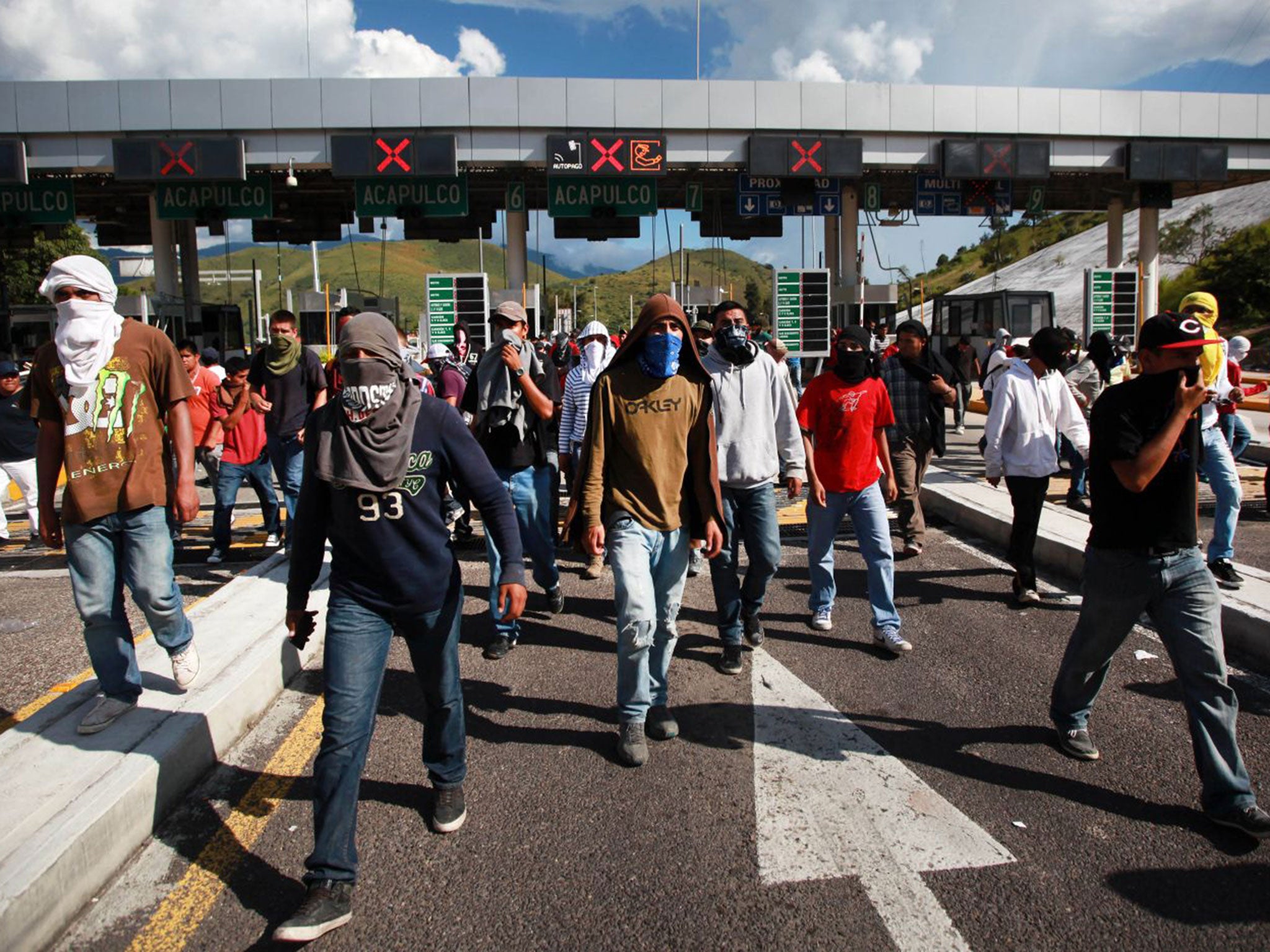 Friends and relatives of missing students block a main highway in Chilpancingo, Mexico, on Monday