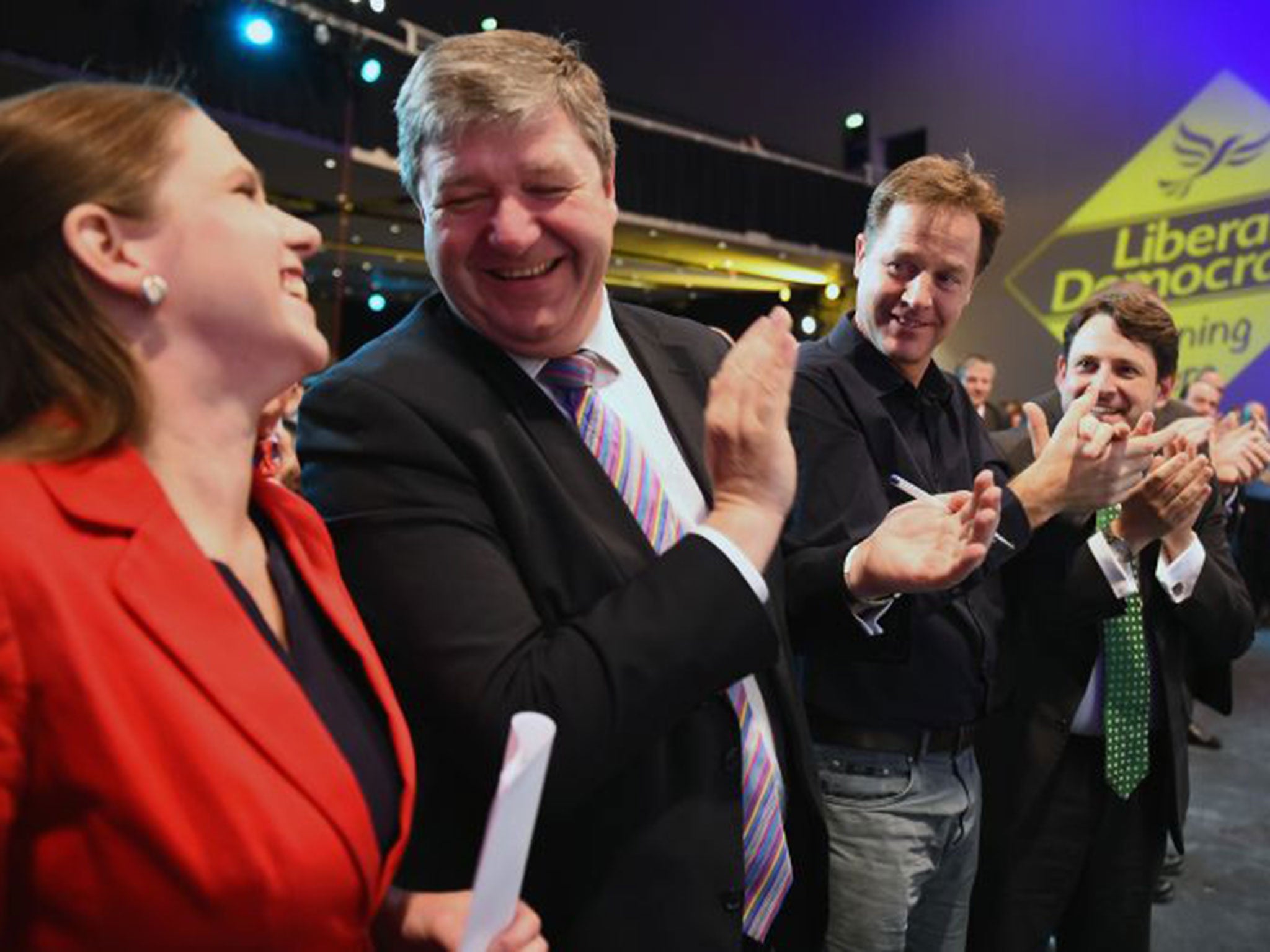 Scottish secretary Alistair Carmichael and Nick Clegg applaud Jo Swinson MP following her address to the conference