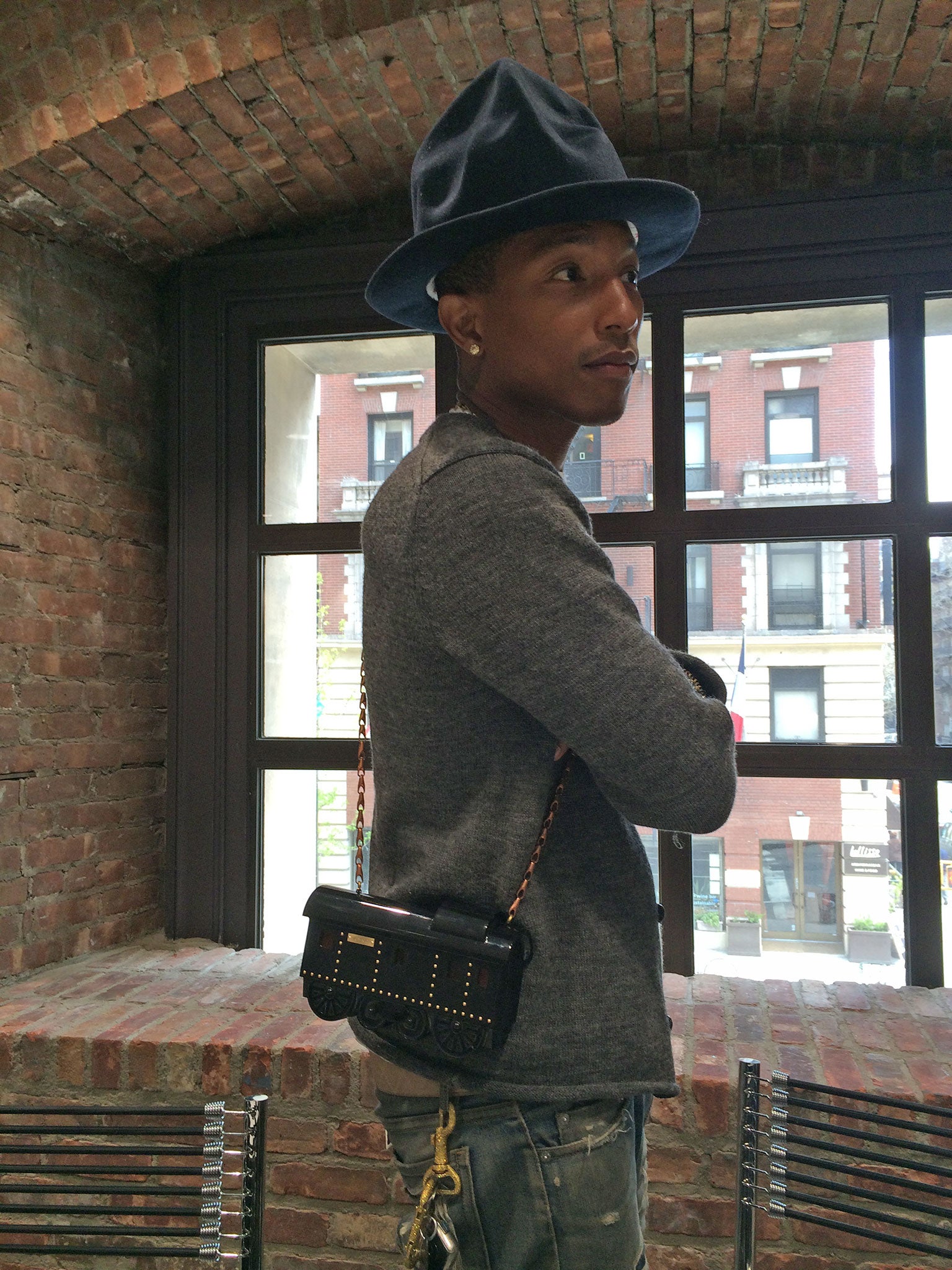 Pharrell Williams wearing one of his creations for Moynat