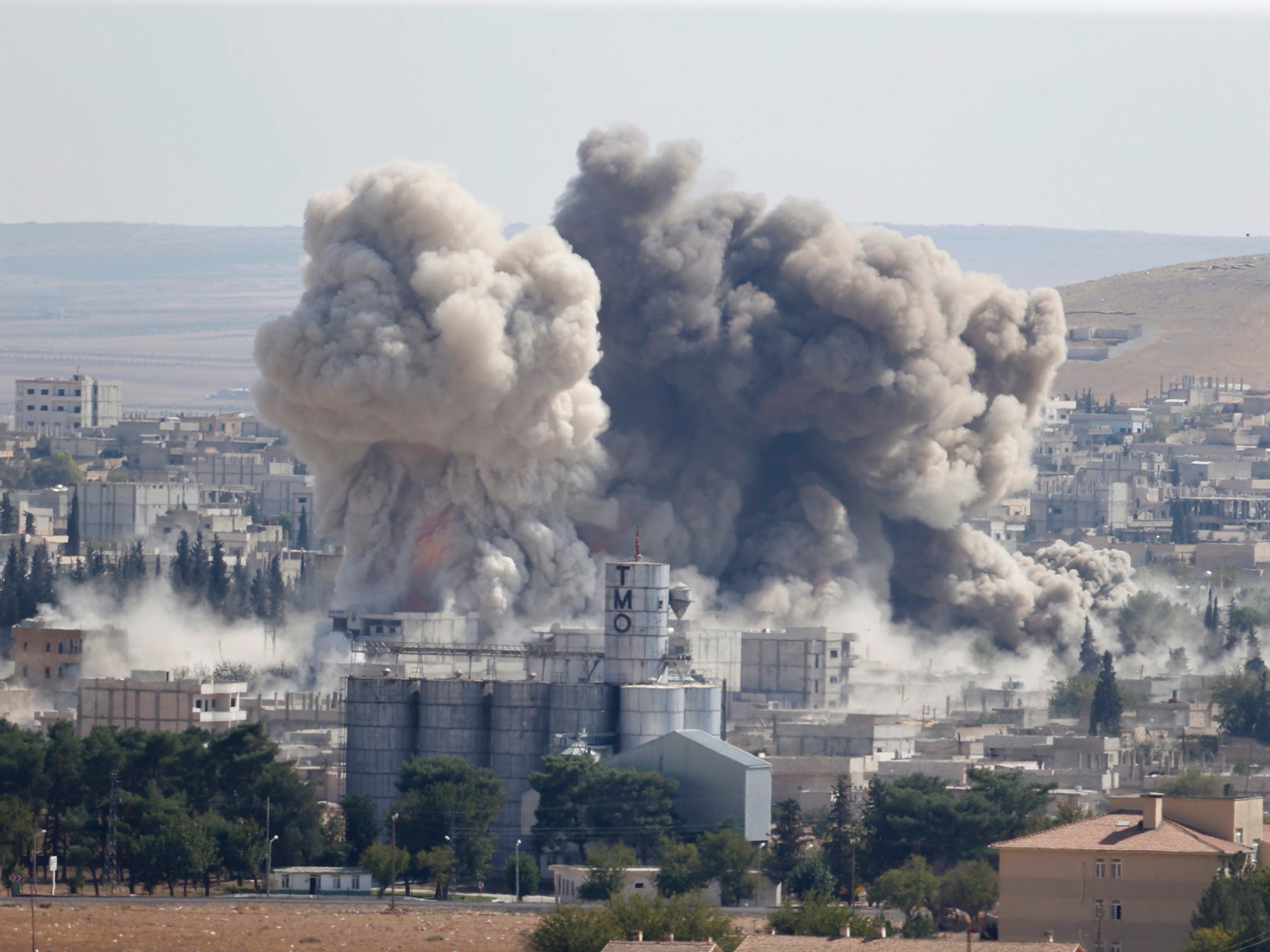 Smoke rises after an U.S.-led air strike in the Syrian town of Kobani.