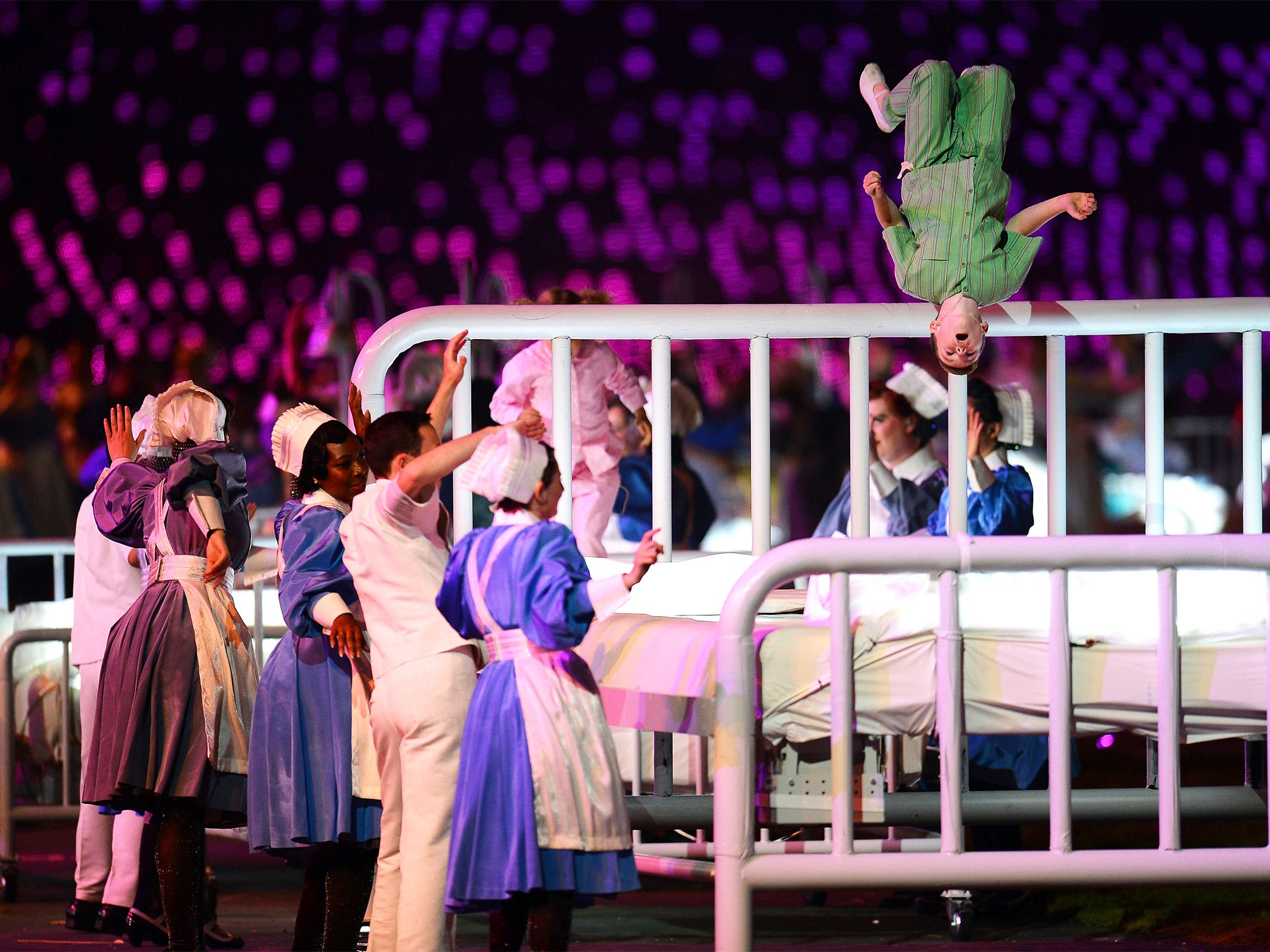 Performers dance during a celebration of the NHS at the Opening Ceremony of the London 2012 Olympic Games