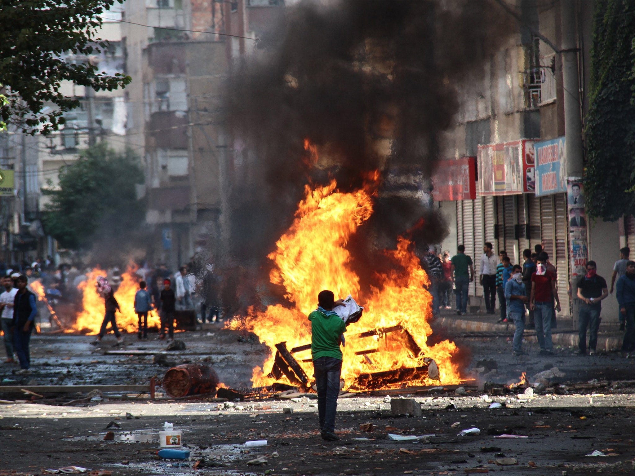 Protestors clashing with riot police during a demonstration in Diyarbakir, Turkey