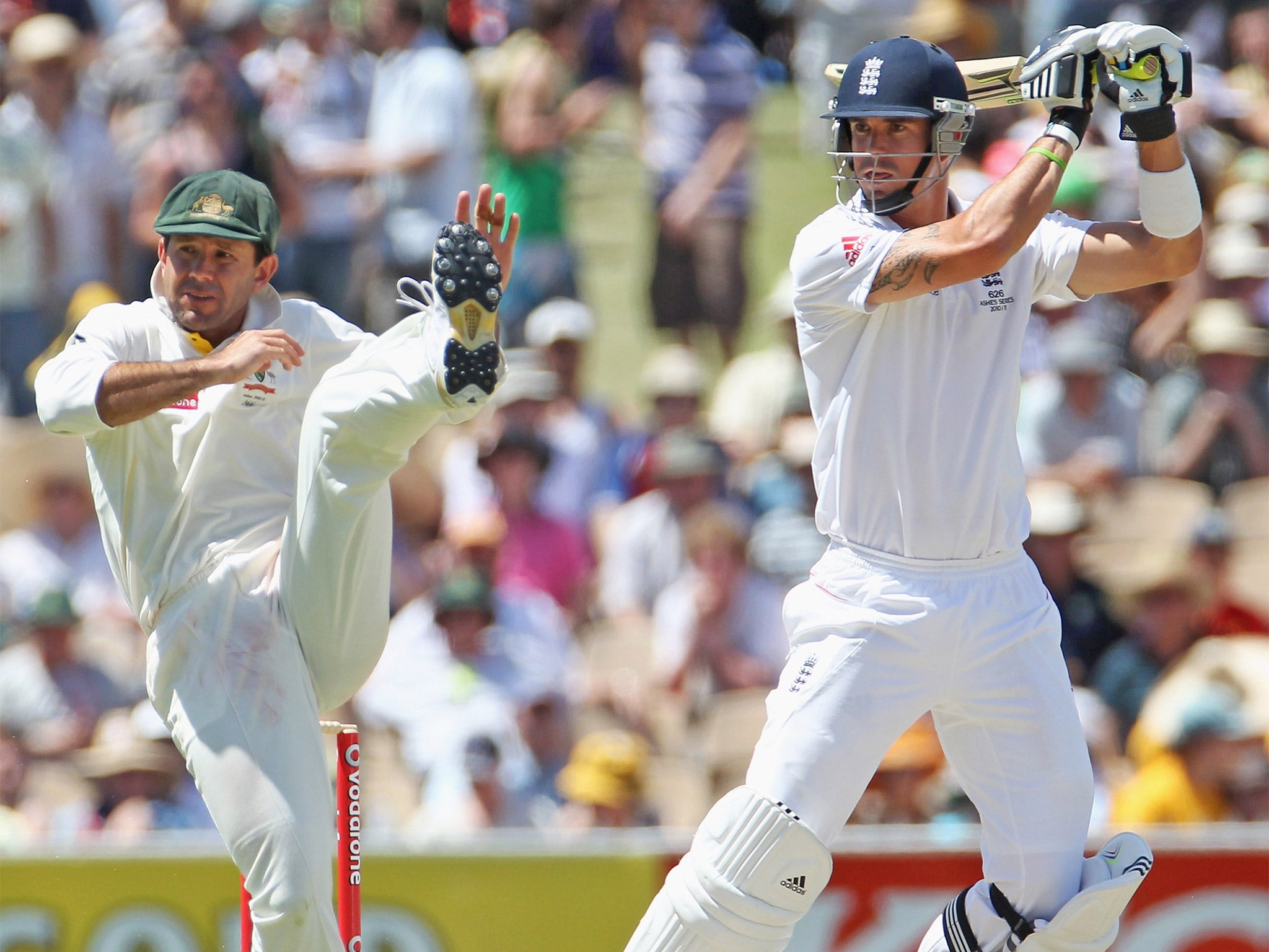 Ricky Ponting tries to evade a shot by Kevin Pietersen in the Ashes Test in Adelaide in 2010