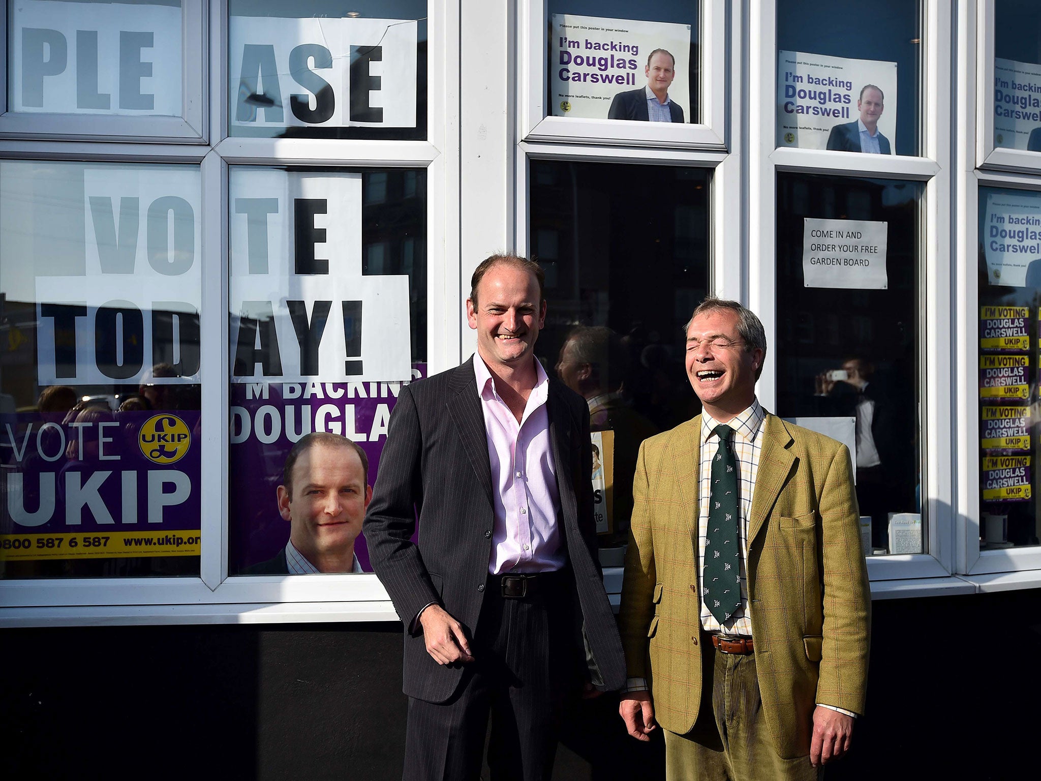 Douglas Carswell (L) and Nigel Farage pose for photographs today in Clacton-on-Sea (AFP)