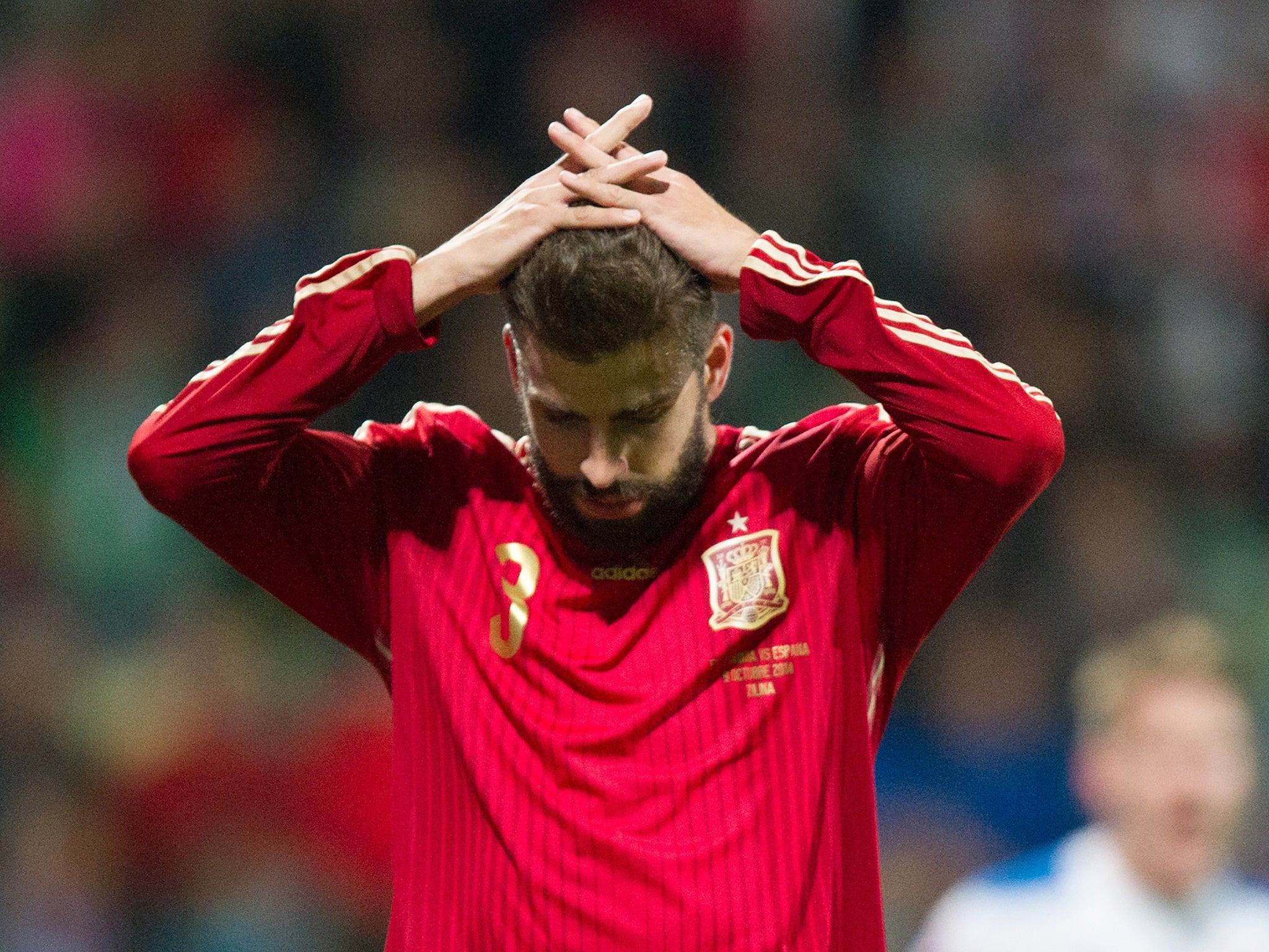 Gerard Pique reacts after Spain lost to Slovakia