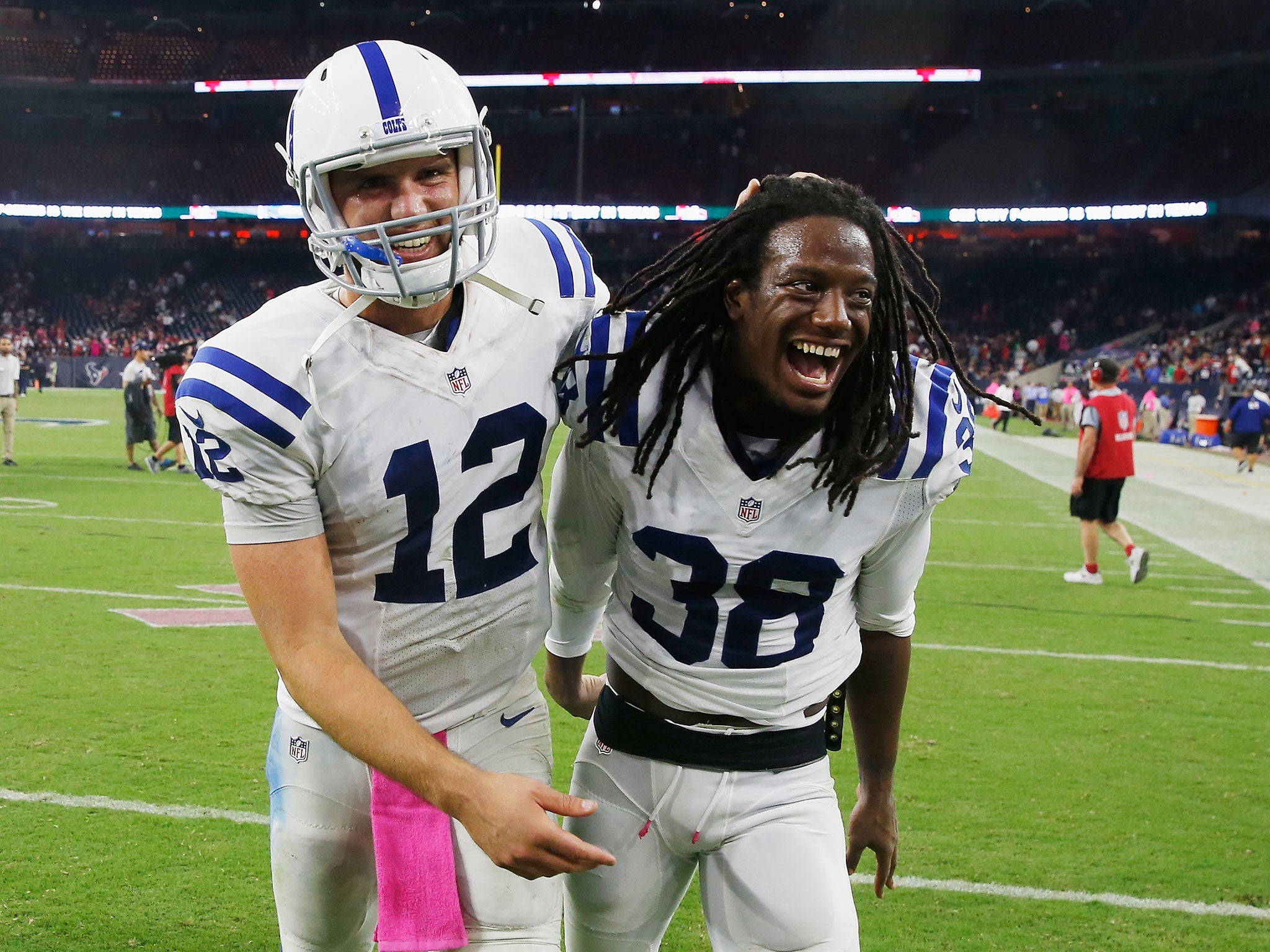 Luck and Sergio Brown celebrate the Colts' victory over the Texans