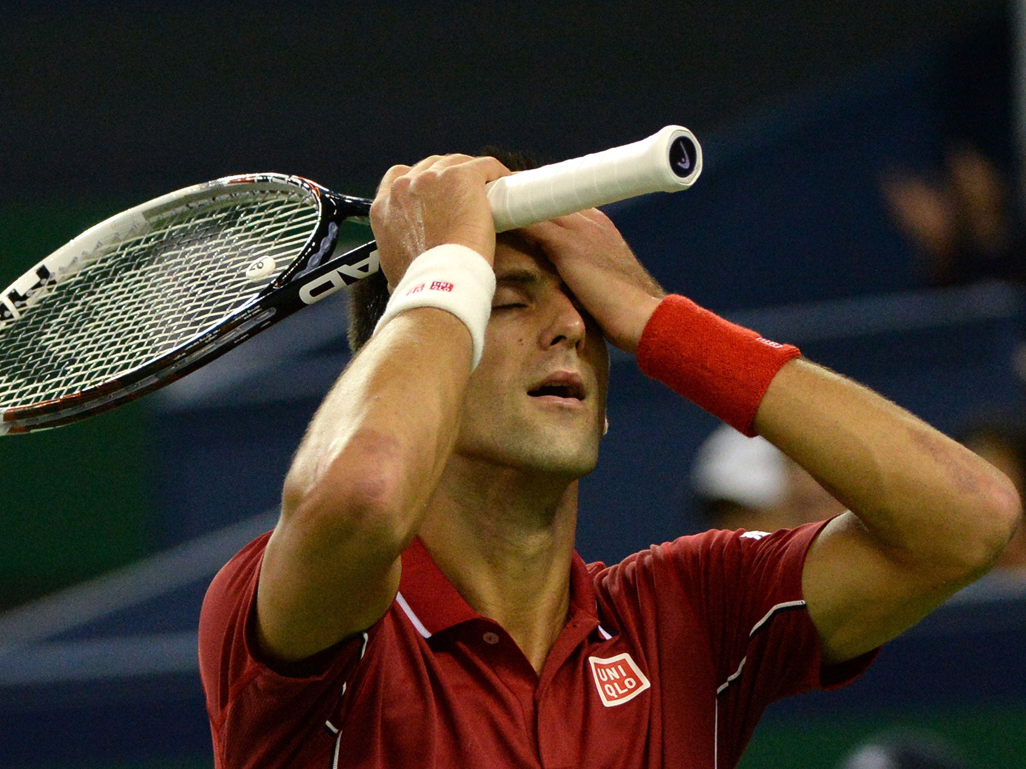 Djokovic reacts after suffering defeat to Federer