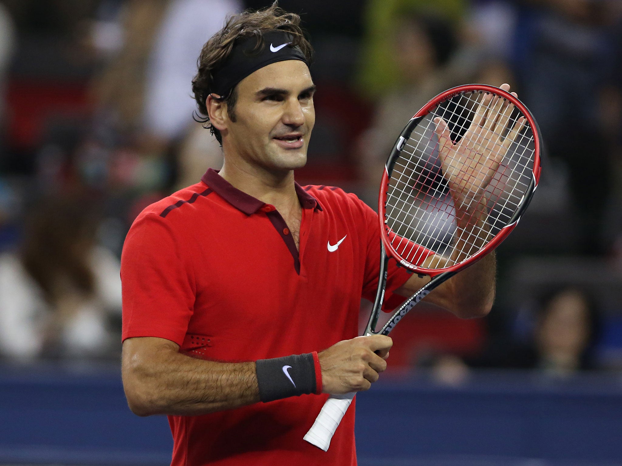 Roger Federe celebrates his 6-4 6-4 win over Novak Djokovic in the Shanghai Masters semi-final