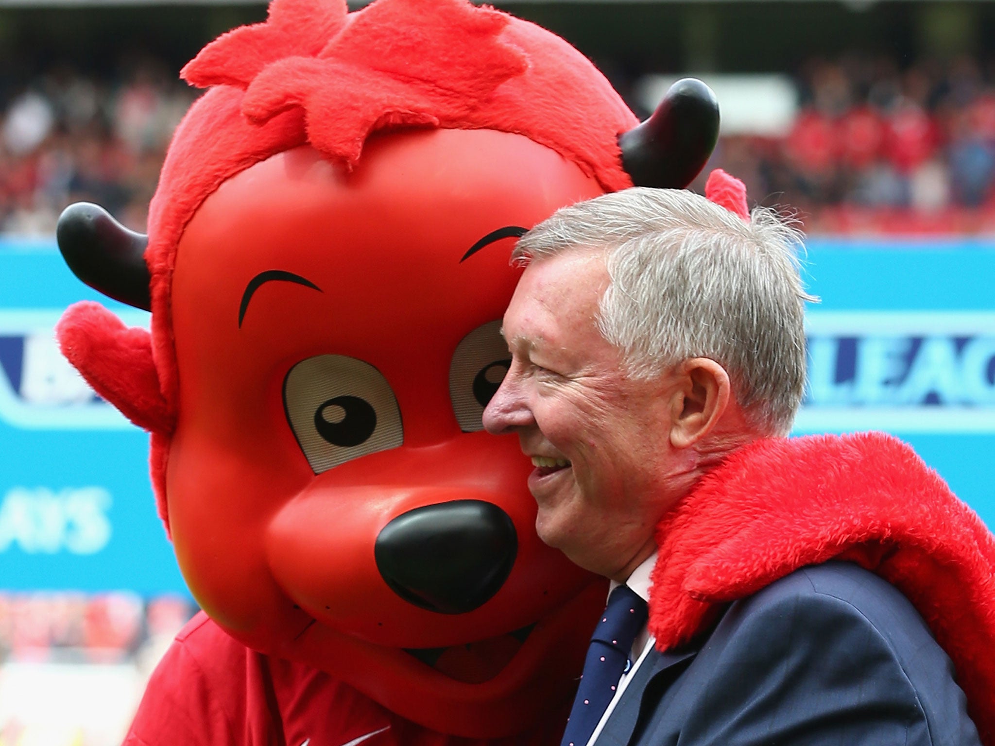 Sir Alex Ferguson with Fred the Red during the Premier League match against Everton at Old Trafford