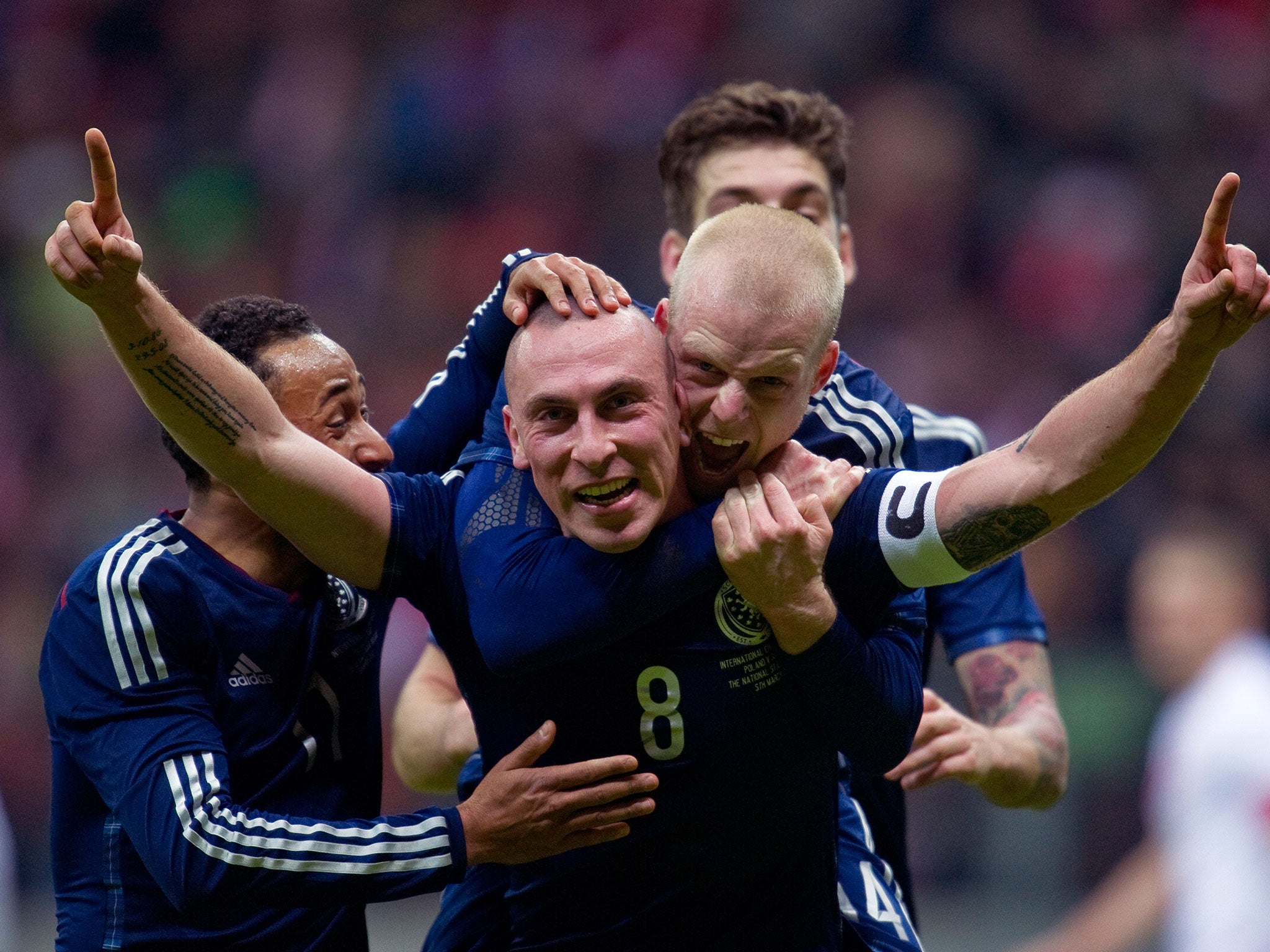 Scott Brown celebrates scoring against Poland in March this year