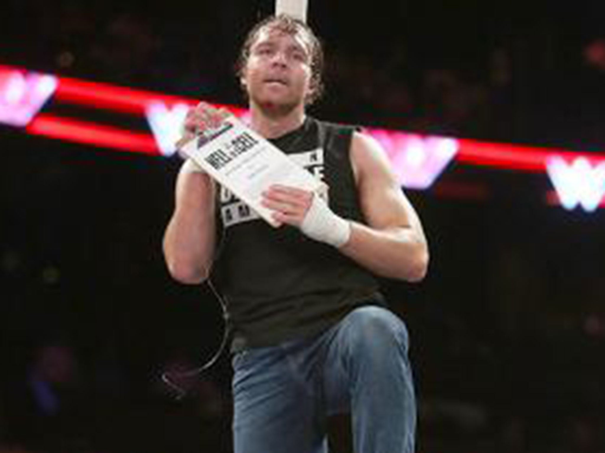 Ambrose grabs the contract to face Seth Rollins at Hell in a Cell