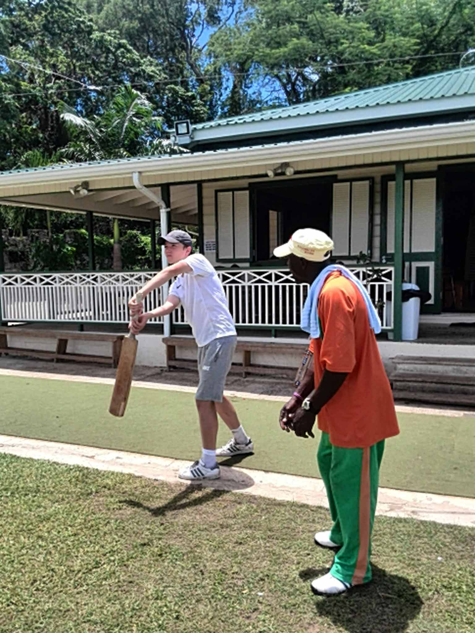 Edward gets batting lessons from Clarkey