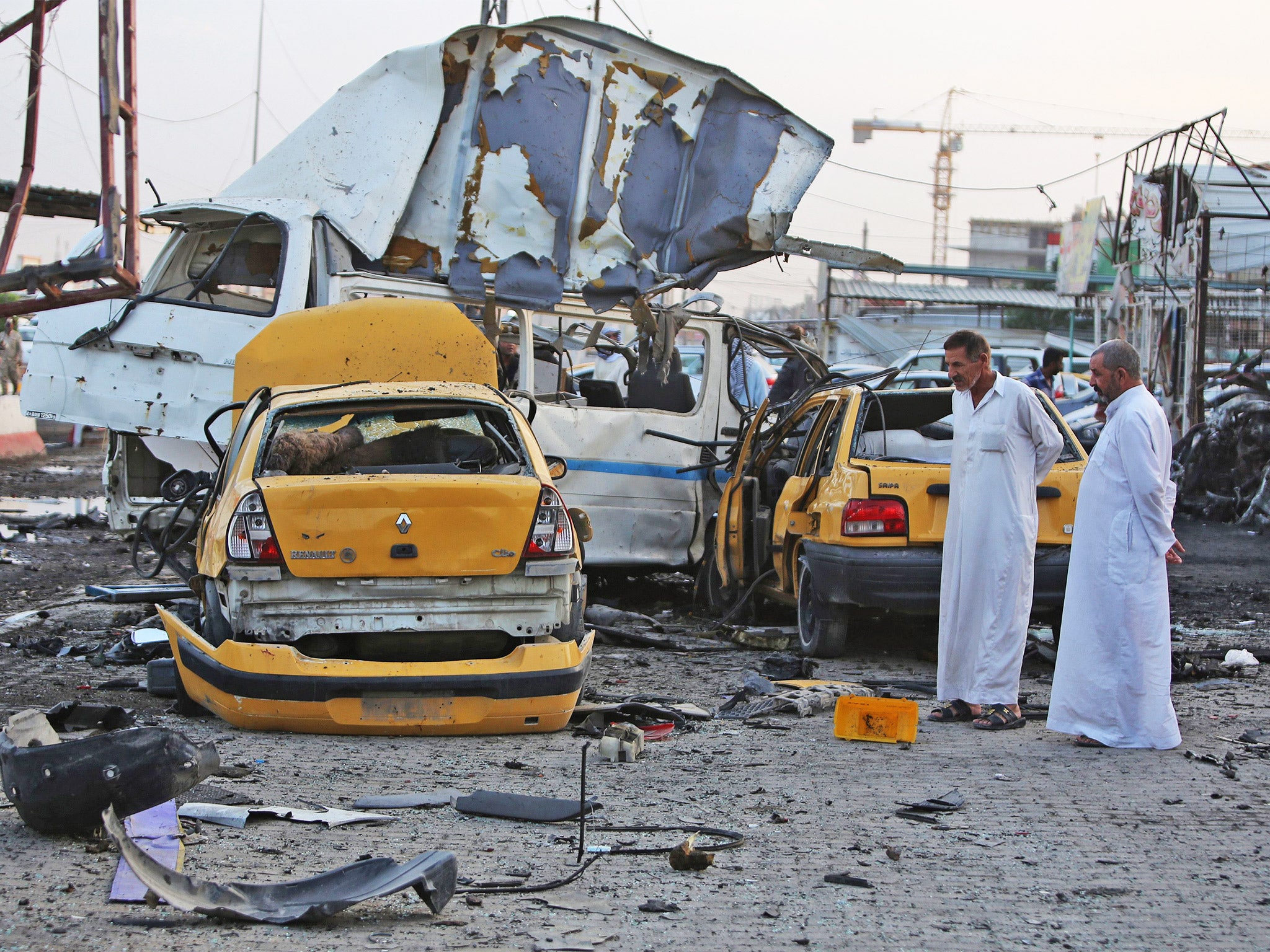 The aftermath of a car-bomb explosion in the mostly Shia Sadr City district of Baghdad on Tuesday, one of three within an hour (Getty)