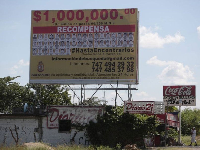 A billboard offering a one million Mexican pesos reward for information leading to the whereabouts of 43 Ayotzinapa Teacher Training College students