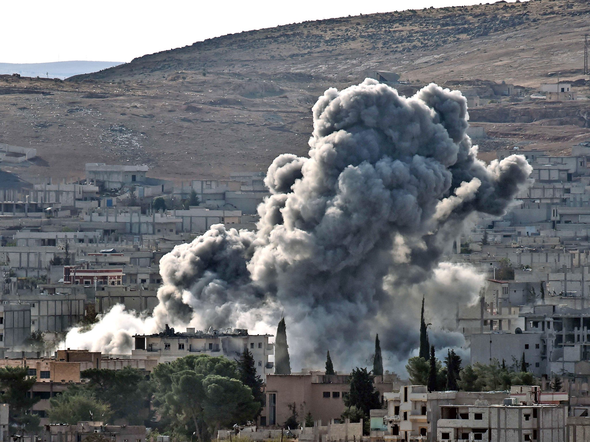 Smoke rises from the Syrian town of Kobani